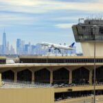 Flight disruptions are mounting at Newark Liberty International Airport as a critical shortage of air traffic controllers combines with ongoing runway construction. United Airlines has already cut dozens of flights, and passengers are experiencing longer delays and unpredictable schedules. As the summer travel surge nears, the FAA faces growing scrutiny for not resolving staffing gaps in one of the nation’s busiest air corridors.