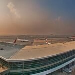 Delhi’s Indira Gandhi International Airport is witnessing heavy flight delays and diversions today due to a combination of severe thunderstorms, runway closures for repair work, and limited access to Pakistani airspace. These overlapping issues have caused significant operational strain, with both domestic and international flyers facing long wait times and unexpected changes. Passengers are being advised to check with their airlines for real-time updates before heading to the airport. Meanwhile, aviation authorities are working round the clock to minimize disruptions.