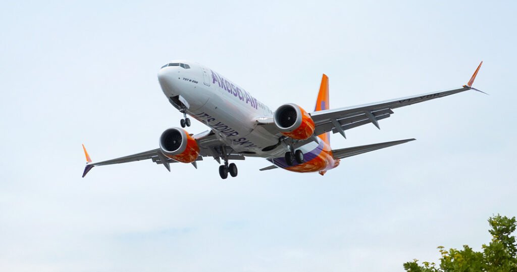 Bengaluru, India: In a significant milestone for India’s newest airline, Akasa Air has officially inducted its 29th aircraft into its growing fleet. The new Boeing 737 MAX 8-200, bearing the registration VT-YBG, landed at Bengaluru’s Kempegowda International Airport on Sunday. Akasa Air, which began operations in August 2022, has now reached 29 aircraft in less than three years of commercial service. This addition underscores the airline’s accelerated fleet expansion plan, which aims to double its current capacity in the next two years. The latest aircraft is part of Akasa’s large order book of over 200 Boeing 737 MAX aircraft, including both the MAX 8 and the high-density MAX 8-200 variants. The MAX 8-200 aircraft offer increased seating and fuel efficiency, enabling the airline to improve operating economics while maintaining passenger comfort. The airline’s operations team and ground staff welcomed the aircraft with customary water cannon salutes and internal handover protocols. Akasa officials stated that this induction not only marks a numeric achievement but also aligns with the airline’s strategy to increase route frequency and add new destinations across India and abroad. The fleet expansion is crucial to accommodate the rising passenger demand, particularly as the aviation sector sees strong recovery and growth across Tier 1 and Tier 2 cities. Alongside its growing fleet, Akasa is actively preparing for operations out of the upcoming Navi Mumbai International Airport. The airline’s leadership, including CEO Vinay Dube, confirmed that Akasa plans to operate up to 50 daily departures from the new airport once it becomes operational. Initial schedules are expected to include around 15 domestic and international flights. This move is seen as part of Akasa’s long-term strategy to diversify airport bases and serve emerging passenger corridors beyond existing metros. With consistent aircraft deliveries and a focused route network strategy, Akasa Air continues to position itself as a major player in the Indian aviation sector.