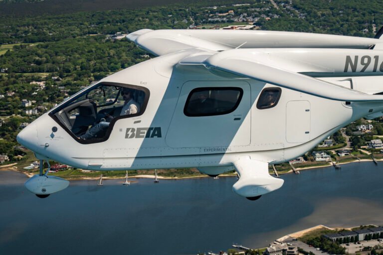 New York, United States: Beta Technologies has achieved a major milestone in electric aviation with the successful passenger flight of its all-electric aircraft, the Alia CX300, to New York’s John F. Kennedy International Airport. The flight marked the first time a fully electric aircraft carrying passengers entered controlled Class B airspace and landed at one of the busiest international airports in the United States. The aircraft departed from East Hampton Airport and completed the journey to JFK covering a distance of approximately 130 kilometers. The flight lasted around 35 minutes and was completed with a total energy cost of under $8, demonstrating the substantial cost-saving potential of electric propulsion compared to conventional fuel-based aircraft. The five occupants on board including four passengers and a pilot, reported a smooth and quiet experience, with noise levels significantly lower than traditional turbine aircraft. The flight proceeded under Visual Flight Rules and received full coordination from JFK’s tower and the New York Port Authority. FAA-Certified The Alia CX300 is a conventional takeoff and landing (CTOL) electric aircraft with a range of up to 250 nautical miles on a single charge. It received airworthiness certification from the U.S. Federal Aviation Administration, affirming its readiness for deployment in cargo, passenger, and special mission roles. The aircraft is part of Beta’s broader plan to offer electric solutions that cater to regional travel and logistics, particularly short-haul routes underserved by major airlines. With its proven operational capability and certification in place, the CX300 is being evaluated by multiple agencies, including the U.S. Air Force and Army, for defense and emergency response operations. Infrastructure and Commercial Expansion Beta Technologies is also investing heavily in the supporting infrastructure necessary to enable widespread electric flight. The company has established 46 electric aircraft charging stations across the U.S., with dozens more in development. These stations are strategically located at airports and logistics hubs to facilitate cross-country operations. Beta does not intend to operate its own fleet of aircraft. Instead, the company aims to sell the aircraft and associated charging infrastructure to customers in both civil and government sectors. Key commercial partners include UPS, Bristow Group, Metro Aviation, and Air New Zealand. In addition to the CX300, Beta is developing the Alia A250, a vertical take-off and landing (VTOL) version for urban and remote operations. Both aircraft share common airframes and power systems, which streamlines maintenance and pilot training requirements. Global Demonstrations and Future Outlook Following its high-profile arrival at JFK, Beta Technologies has expanded its demonstration campaign internationally. The company has conducted aircraft showings and test flights in Ireland and has scheduled further demonstrations in Norway. These efforts aim to showcase the feasibility of electric aircraft in diverse climates and regulatory environments. Domestically, the CX300 completed a six-week, 22-state tour to validate its operational capabilities, including successful landings at busy airports under Instrument Flight Rules (IFR). Beta Technologies has raised over $1 billion in investment funding to support production, certification, and commercialization. The company’s long-term vision includes integrating electric aircraft into public and private transportation networks, particularly for roles where noise, emissions, and operating costs are key concerns.