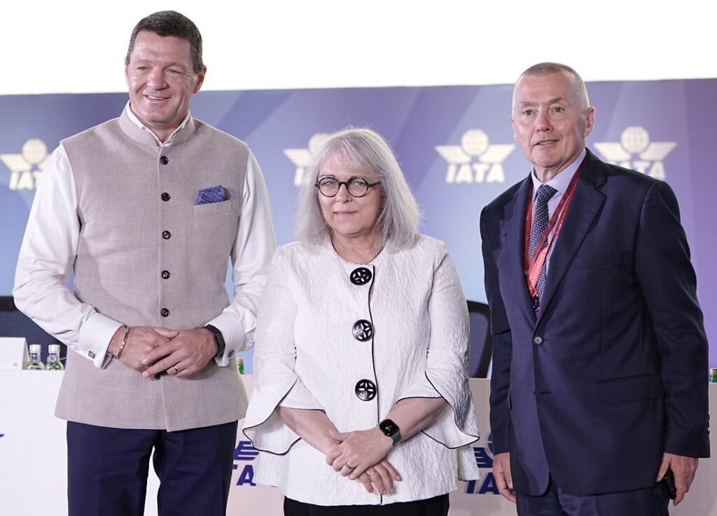 New Delhi, India: The International Air Transport Association (IATA) concluded its 81st Annual General Meeting (AGM) in New Delhi, bringing together more than 300 airline CEOs, regulators, and aviation stakeholders from across the globe. Hosted by IndiGo, the event marked India's first time hosting the AGM in over four decades and focused on rebuilding resilience in the aviation industry through growth, sustainability, and strategic collaboration.
The agenda covered financial projections, climate targets, airspace challenges, and infrastructure investments, but the meeting also served as a global stage for key announcements from leading airlines shaping the post-pandemic recovery.
Industry Financial Outlook and Challenges
IATA adjusted its 2025 profit outlook slightly downward, projecting a global net profit of $36.0 billion, down from the $36.6 billion estimate released earlier this year. This revision, according to IATA, reflects macroeconomic uncertainty, prolonged aircraft delivery delays, and airspace restrictions in several regions.
Despite the dip, the global aviation industry remains on a path to recovery, with projected total revenues nearing $979 billion and passenger traffic expected to approach 5 billion in 2025. However, cargo revenues have cooled, stabilizing at levels below pandemic highs.
Carbon Commitments and SAF Bottlenecks
Sustainability remained central to this year’s AGM, with global carriers reaffirming their commitment to achieving net-zero carbon emissions by 2050. IATA noted that the goal requires cumulative investment of nearly $4.7 trillion, a major portion of which depends on ramping up Sustainable Aviation Fuel (SAF) production.
Currently, SAF accounts for less than 1% of total aviation fuel use. Airline executives urged governments to create policy frameworks and incentives for SAF manufacturing, pointing out that current supply levels are far from sufficient to support decarbonization targets.
Safety Amid Geopolitical Disruptions
Several airline heads, including those from Middle Eastern and European carriers, raised concerns over growing airspace instability due to geopolitical tensions. Conflicts in Eastern Europe and the Middle East have forced longer detours, increasing fuel burn and operational costs.
IATA is working with global regulators to enhance coordination between civil aviation bodies and defense authorities, aiming to reduce rerouting delays and improve forecasting of regional airspace risks.
Key Airline Developments Announced During the AGM
Several airlines made significant announcements at the AGM that align with broader industry goals of network expansion, sustainability, and digital integration:
IndiGo, India’s largest airline by market share, announced that it is doubling its widebody order of Airbus A350s, adding 30 more aircraft to its existing order of 30. This move signals a clear shift toward international long-haul operations, with deliveries expected to begin in 2027.
Virgin Australia revealed plans to return to the Australian Securities Exchange (ASX) through a $2.3 billion IPO, offering more than 236 million shares at $2.90 each. The listing reflects the airline’s renewed financial health following its 2020 administration and a tighter focus on domestic operations and profitability.
Air India and Air Mauritius jointly announced the expansion of their existing codeshare agreement, improving connectivity between India and Africa. Effective July 1, 2025, the agreement is expected to enhance route integration, streamline passenger transfers, and expand seat availability on shared routes.
Riyadh Air, the emerging Saudi national carrier expected to launch commercial operations in 2025, signed multiple MoUs with global airlines including Singapore Airlines, Delta Air Lines, and China Eastern. These partnerships aim to facilitate future codeshare routes and lay the groundwork for integrated digital platforms.
Aegean Airlines confirmed that it will commence direct flights between Athens and India using its new Airbus A321LR aircraft, with services expected to start by 2027. The move marks the Greek carrier’s first foray into the Indian market, aiming to tap into growing travel and tourism demand between Southern Europe and South Asia.
India’s Aviation Growth Trajectory
During the inaugural session, Prime Minister Narendra Modi addressed delegates via video message, presenting India’s vision to become a global aviation hub by 2047, coinciding with the country's 100th year of independence. The government aims to increase the number of operational airports from 157 to 400, while tripling passenger capacity over the next two decades.
India’s aviation sector, already one of the fastest-growing globally, is witnessing rapid infrastructure expansion. However, challenges such as pilot shortages, aircraft supply constraints, and simulator training capacity remain pressing issues. Several airlines are already in talks with global training providers to bridge the gap.
IATA Leadership and AGM 2026 Host
Luis Gallego, CEO of International Airlines Group (IAG), was appointed as the Chair of the IATA Board of Governors, succeeding Marjan Rintel of KLM. Gallego will lead the board through the next term, focusing on accelerating climate transitions, digital transformation, and cross-border operational standardization.
It was also confirmed that the 82nd IATA AGM will be held in Rio de Janeiro, Brazil, in June 2026, hosted by LATAM Airlines Group.
About IATA:
The International Air Transport Association represents more than 320 airlines, accounting for over 80% of global air traffic. The AGM serves as the association’s highest decision-making body, enabling members to discuss policy, industry challenges, and future direction.