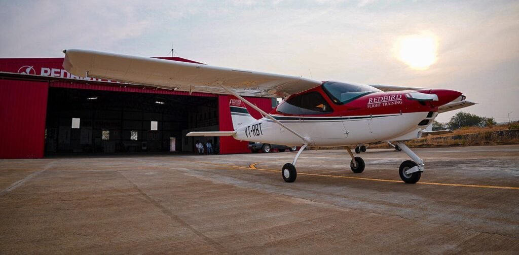 Madhya Pradesh, India: On May 30, 2025, a training aircraft operated by Redbird Aviation Pvt. Ltd. overturned during landing at the Suktara airstrip in Seoni district, Madhya Pradesh. The aircraft was being flown solo by a trainee woman pilot on a routine training flight. According to preliminary reports, the aircraft flipped due to a faulty landing. Fortunately, the pilot escaped without injuries, and no fire was reported following the incident. Staff from Redbird Aviation promptly emptied the aircraft’s fuel tank to minimize any risk of fire. The Suktara airstrip, situated approximately 22 kilometers from the Seoni district headquarters, is maintained by the Madhya Pradesh Public Works Department. It is regularly used by Redbird Aviation, a Delhi-based pilot training organization, for conducting flight training sessions. In response to the accident, the District Collector, Sanskriti Jain, ordered an inquiry to investigate the precise cause of the aircraft overturning. The Directorate General of Civil Aviation (DGCA) has also been notified and is expected to carry out a thorough inspection of the airstrip and operations. Meanwhile, all trainee flights from the Suktara airstrip have been temporarily suspended pending the results of the investigation. This incident is part of a series of recent accidents involving training aircraft in India, raising concerns about flight training safety. On April 22, 2025, a training aircraft belonging to Vision Flying Training Institute crashed in a residential area of Amreli district, Gujarat, resulting in the death of the trainee pilot. Earlier, on May 5, 2025, a trainee pilot from Pioneer Flying Academy narrowly escaped injury when his aircraft crashed into the boundary wall of the Dhanipur Airstrip in Aligarh, Uttar Pradesh. Redbird Aviation itself has experienced multiple incidents over the past few years. In March 2023, a trainee pilot had a hard landing at Indore airfield, which caused minor damage to the aircraft but no injuries. In July 2024, a Redbird training aircraft encountered engine trouble mid-flight but managed to land safely without casualties. In December 2024, another Redbird training aircraft skidded off the runway at Suktara airstrip during wet conditions; the trainee pilot was unharmed in that event. The Directorate General of Civil Aviation is expected to conduct a detailed review of these incidents and the existing safety protocols for flight training operations. The investigation aims to identify any procedural lapses or technical issues to prevent similar accidents in the future. Temporary suspension of training flights at locations involved in such incidents is a precautionary step to ensure trainee and public safety.