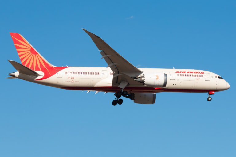 Ahmedabad, India: The Aircraft Accident Investigation Bureau (AAIB) has released the preliminary report into the crash of Air India’s Boeing 787-8 Dreamliner, registration VT-ANB, which occurred on 12 June 2025 shortly after takeoff from Ahmedabad’s Sardar Vallabhbhai Patel International Airport. The scheduled flight, operating as AI171, was bound for London Gatwick Airport with 230 passengers, 10 cabin crew, and 2 flight crew on board. All 241 persons on board perished in the accident. Additionally, 19 fatalities were reported on the ground. Aircraft and Crew Information The aircraft involved was a Boeing 787-8 with serial number 36279, manufactured in 2013, and operated by Air India. Both engines were General Electric GEnx-1B series units, installed in March and May 2025 respectively. The aircraft had a valid Certificate of Airworthiness and had undergone its last Airworthiness Review on 22 May 2025. The Pilot-in-Command held an ATPL with over 15,638 hours of total flying experience, including 8,596 hours on type. The First Officer held a CPL with 3,403 hours of total flying experience, of which 1,128 hours were on type. Both pilots were based in Mumbai, had arrived in Ahmedabad the previous day, and had met required rest periods. The First Officer was the Pilot Flying for the accident flight. Sequence of Events On 12 June 2025, VT-ANB had earlier operated AI423 from Delhi and landed at Ahmedabad at 05:47 UTC. A post-flight defect regarding “STAB POS XDCR” was logged and addressed by on-duty maintenance personnel before the aircraft was released for its next flight. Flight AI171 was scheduled for departure at 07:40 UTC. The aircraft pushed back from Bay 34 at 07:48 UTC, taxied to Runway 23, and received takeoff clearance at 08:07:33 UTC. The aircraft began its takeoff roll at 08:07:37 UTC. According to data recovered from the Enhanced Airborne Flight Recorder (EAFR), the aircraft reached V1 at 08:08:33 UTC and rotation speed (Vr) at 08:08:35 UTC. It lifted off at 08:08:39 UTC and reached a maximum recorded indicated airspeed of 180 knots at 08:08:42 UTC. At that moment, both engine fuel control switches, first for Engine 1 and then for Engine 2, with a one-second interval transitioned from the “RUN” to the “CUTOFF” position. The data indicated an immediate decrease in N1 and N2 engine speeds, consistent with fuel supply being cut off. Cockpit voice recordings captured a pilot questioning the action, with one asking, “Why did you cut off?” and the other responding that he had not. No further verbal conflict or distress was recorded before the power loss. Power Loss and Emergency Response The sudden loss of thrust from both engines triggered the deployment of the Ram Air Turbine (RAT), visible on CCTV footage from the airport. The RAT began supplying hydraulic power by 08:08:47 UTC, confirming the engines were no longer providing power. At 08:08:52 UTC, the Engine 1 fuel control switch was moved back to “RUN,” followed by Engine 2 at 08:08:56 UTC. The Auxiliary Power Unit (APU) inlet door also began to open at this time, indicating an automatic start sequence. Both engines attempted relight: Engine 1 showed signs of core recovery, while Engine 2 relit but could not stabilize its core speed. At 08:09:05 UTC, a MAYDAY call was transmitted by one of the pilots. No further communication was received. The aircraft lost altitude rapidly and crashed into the BJ Medical College hostel complex approximately 0.9 nautical miles from the end of Runway 23. The impact caused destruction of five buildings and extensive fire damage. All occupants of the aircraft were fatally injured. According to the report, the Emergency Locator Transmitter (ELT) was not activated during the sequence. Recovery and Wreckage The wreckage was spread across an area of approximately 1000 feet by 400 feet. The vertical stabilizer, main landing gear, fuselage components, both engines, and nose gear were found at various distances from the initial impact point. The thrust levers were discovered near the idle position, though flight data indicated they were forward (takeoff thrust) until impact. The fuel control switches were found in the “RUN” position post-crash. The forward EAFR was successfully recovered and downloaded using equipment supplied by the U.S. National Transportation Safety Board (NTSB). It contained approximately 49 hours of flight data and two hours of audio, including the accident flight. The aft EAFR was too severely damaged to retrieve data. Ongoing Investigation The investigation team comprises AAIB India officers, subject matter experts, and international participants from NTSB (USA), Boeing, General Electric, the FAA, and authorities representing nations whose citizens were onboard. As of the preliminary report, there are no recommendations issued to operators or manufacturers of the B787-8 aircraft or GEnx-1B engines. Fuel samples tested from the bowsers and tanks used to refuel the aircraft were found satisfactory. Additional trace samples collected from the APU and refuel/jettison systems are being sent for further testing. Statements from witnesses and the sole surviving passenger have been recorded. Post-mortem analyses are underway to determine any relevant aeromedical findings. The AAIB emphasized that the investigation remains ongoing, and all evidence, including maintenance records, crew history, and system components, will continue to be evaluated.