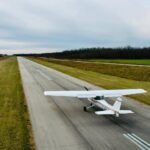 Manitoba, Canada: Two student pilots lost their lives in a mid-air collision involving training aircraft operated by Harv’s Air near Steinbach South Airport in the Rural Municipality of Hanover, Manitoba. The incident occurred at approximately 8:45 a.m. on 8 July during routine circuit training. According to the Royal Canadian Mounted Police (RCMP), the aircraft involved a Cessna 152 and a Cessna 172 collided roughly 400 metres from the runway while performing training exercises involving takeoffs and landings. Emergency services responded swiftly, but both pilots ,one male and one female were pronounced dead at the scene. No passengers were on board either aircraft. The names of the deceased have not yet been released pending family notifications. Both aircraft were registered to Harv’s Air, a well-established flight training school in Manitoba. Initial information suggests that one aircraft was on final approach while the other was climbing out, likely after a touch-and-go. The school’s owner indicated the collision may have resulted from a breakdown in visual separation or communication between the two student pilots. Weather conditions were reported to be favourable at the time of the accident. There is no evidence of mechanical failure or external interference. RCMP have ruled out criminal involvement. The Transportation Safety Board of Canada (TSB) has launched a full investigation. Officials are analyzing flight logs, maintenance records, and any available radio communications. A team has been dispatched to the site to conduct a detailed examination of the wreckage and to interview witnesses and school personnel. Harv’s Air released a statement expressing condolences to the families and confirming that flight training operations have been suspended temporarily out of respect and to support the investigation. Previous Incident in British Columbia In a separate incident earlier this year, on April 18, 2025, a Cessna 172 operated by Principal Air crashed near Chilliwack Airport, British Columbia, during a dual training flight. Both the flight instructor and the student pilot were killed. That flight was also being conducted under daylight VFR conditions and remains under investigation by the TSB. Authorities have not indicated any systemic issues linking the crashes, but findings from both investigations may contribute to broader safety reviews across the general aviation training sector. Further updates will be provided as the investigations proceed