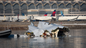 Washington, United States: Investigators probing the January 29 mid‑air collision between U.S. Army Black Hawk helicopter and American Airlines Flight 5342 over the Potomac River revealed a combination of faulty altitude data, communication failures, and ignored safety warnings as contributing factors to the disaster that killed all 67 people aboard the commercial aircraft. During three days of public hearings held this week, the National Transportation Safety Board (NTSB) disclosed evidence that the Black Hawk was operating as much as 100 feet higher than its altimeter indicated, breaching the restricted ceiling for helicopters transiting the congested Reagan National Airport corridor. Officials said the helicopter’s barometric altitude sensors were incorrectly calibrated, a condition also found in similar Army aircraft. “Altitude deviations of that magnitude are unacceptable in such tightly controlled airspace,” said NTSB Chair Jennifer Homendy, noting that the military’s existing tolerance for up to 100 feet of variance was now under review. The hearing also detailed a communication breakdown moments before the collision. A radio transmission from the Black Hawk reportedly “stepped on” the tower controller’s instructions, obscuring critical clearance information. Compounding the error, a single controller was managing both local helicopter and fixed‑wing operations, an arrangement the NTSB described as “operationally unsound for high‑density traffic periods.” The Federal Aviation Administration faced sharp criticism for not acting on repeated warnings from controllers and internal safety analysts. Between 2021 and 2024, more than 15,000 near‑miss events were recorded nationwide, including 84 in the Washington National airspace region. Despite internal proposals to chart helicopter “hot spots” and segregate their routes, no permanent changes were implemented prior to the crash. According to Reuters, Transportation Secretary Sean Duffy told lawmakers that, “This accident reflects systemic failures that cannot be excused by procedural norms or military exemptions.” On Tuesday, Senator Ted Cruz introduced bipartisan legislation requiring all military and training helicopters operating near commercial corridors to activate ADS‑B Out tracking, which broadcasts precise position and altitude to air traffic control and other aircraft. The bill also calls for a comprehensive review of flight routing in mixed‑use airspace and a federal audit of aviation oversight practices. The Army confirmed that ADS‑B tracking had been disabled during the helicopter’s test mission, a common practice for certain military flights but one that reduced situational awareness in an already crowded corridor. Families of victims, along with aviation safety advocates, have welcomed the proposed reforms, though the NTSB cautioned that a final report is not expected until 2026.