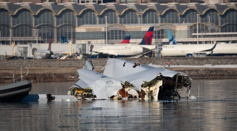 Washington, United States: Investigators probing the January 29 mid‑air collision between U.S. Army Black Hawk helicopter and American Airlines Flight 5342 over the Potomac River revealed a combination of faulty altitude data, communication failures, and ignored safety warnings as contributing factors to the disaster that killed all 67 people aboard the commercial aircraft. During three days of public hearings held this week, the National Transportation Safety Board (NTSB) disclosed evidence that the Black Hawk was operating as much as 100 feet higher than its altimeter indicated, breaching the restricted ceiling for helicopters transiting the congested Reagan National Airport corridor. Officials said the helicopter’s barometric altitude sensors were incorrectly calibrated, a condition also found in similar Army aircraft. “Altitude deviations of that magnitude are unacceptable in such tightly controlled airspace,” said NTSB Chair Jennifer Homendy, noting that the military’s existing tolerance for up to 100 feet of variance was now under review. The hearing also detailed a communication breakdown moments before the collision. A radio transmission from the Black Hawk reportedly “stepped on” the tower controller’s instructions, obscuring critical clearance information. Compounding the error, a single controller was managing both local helicopter and fixed‑wing operations, an arrangement the NTSB described as “operationally unsound for high‑density traffic periods.” The Federal Aviation Administration faced sharp criticism for not acting on repeated warnings from controllers and internal safety analysts. Between 2021 and 2024, more than 15,000 near‑miss events were recorded nationwide, including 84 in the Washington National airspace region. Despite internal proposals to chart helicopter “hot spots” and segregate their routes, no permanent changes were implemented prior to the crash. According to Reuters, Transportation Secretary Sean Duffy told lawmakers that, “This accident reflects systemic failures that cannot be excused by procedural norms or military exemptions.” On Tuesday, Senator Ted Cruz introduced bipartisan legislation requiring all military and training helicopters operating near commercial corridors to activate ADS‑B Out tracking, which broadcasts precise position and altitude to air traffic control and other aircraft. The bill also calls for a comprehensive review of flight routing in mixed‑use airspace and a federal audit of aviation oversight practices. The Army confirmed that ADS‑B tracking had been disabled during the helicopter’s test mission, a common practice for certain military flights but one that reduced situational awareness in an already crowded corridor. Families of victims, along with aviation safety advocates, have welcomed the proposed reforms, though the NTSB cautioned that a final report is not expected until 2026.