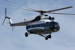 Magadan, Russia: Russian emergency authorities have confirmed the deaths of five people following the crash of a Mil Mi-8 helicopter that went missing earlier this week in the country’s Far Eastern region. The helicopter, operated by Magadan-based civil aviation company APK Vzlyot, had been en route from Chumikan to Magadan on July 14 when it lost radio contact and disappeared from radar. The aircraft was carrying three crew members and two technical staff at the time. Following an intensive search operation, Russia’s Ministry of Emergency Situations (EMERCOM) announced on July 16 that the wreckage was discovered near Cape Gadikan in Khabarovsk Krai, a remote and mountainous coastal area along the Sea of Okhotsk. All five individuals on board were found dead. “The search and rescue team located the aircraft's debris in a hard-to-reach area. There were no survivors,” a spokesperson for the Ministry stated. No Distress Signal Received Officials confirmed that no distress signal had been received from the helicopter prior to its disappearance. The emergency locator beacon reportedly failed to activate, which complicated the initial search efforts. Weather conditions in the region, known for heavy fog and rugged terrain, had also hampered aerial reconnaissance flights during the first two days of the operation. Criminal Investigation Underway Russia’s Investigative Committee has launched a criminal case under Article 263 of the Russian Criminal Code, which addresses violations of safety rules during air transport operations. The probe will focus on whether flight safety regulations were properly followed by the operator. Investigators are currently examining the crash site and are expected to retrieve flight documentation and inspect any recoverable components of the aircraft. There is no official comment yet regarding the helicopter’s technical condition or any preliminary cause of the crash. Background on the Aircraft and Operator The Mi-8 is a Soviet-designed medium twin-turbine helicopter widely used in both civil and military aviation. Despite its age, it remains in extensive service across remote regions of Russia due to its reliability and load-carrying capability. APK Vzlyot, the operator of the downed helicopter, provides cargo and passenger transport services across the Russian Far East. The company has not released a public statement as of this writing but is cooperating with authorities. This is a developing story. Further details will be provided as they are released by EMERCOM, the Investigative Committee, or Rosaviatsiya, Russia’s federal air transport agency.