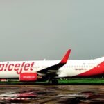 New Delhi: A SpiceJet flight preparing for departure from Delhi was disrupted earlier this week after the aircraft's air-conditioning system failed while passengers were still boarding. The incident, captured on video by passengers and widely shared on social media, drew criticism over cabin preparedness and passenger handling on the ground. Onboard Discomfort Escalates The incident occurred on July 15 on a domestic SpiceJet flight at Delhi’s Indira Gandhi International Airport. According to passenger reports and video evidence, the aircraft remained on the ground for an extended period with no active air-conditioning, leading to visibly distressed passengers. Several passengers can be seen fanning themselves and expressing discomfort, with rising cabin temperatures triggering tensions. The video footage captures passengers loudly demanding the crew “AC chala do” (turn on the AC), while others attempted to leave their seats in protest. The cabin crew reportedly made announcements asking passengers to remain seated and assured them that ground staff were working to resolve the issue. However, according to passengers on board, the delay lasted nearly 45 minutes, during which no effective cooling was provided. Unruly Behaviour and Passenger De-boarding As the situation escalated, two passengers were asked to deboard after allegedly arguing with the crew and attempting to approach the front galley. SpiceJet, in a brief internal report reviewed by airport sources, confirmed that the two individuals were offloaded for non-compliance with crew instructions. Security staff and airline representatives were called to the aircraft, and the situation was resolved without further delay. The aircraft was later cleared for departure after a technical inspection and resumption of cooling systems. The Directorate General of Civil Aviation (DGCA) has not issued a public statement but is understood to be monitoring the case as part of routine oversight. A preliminary review of aircraft readiness and turnaround procedures may follow, especially given the high ambient temperatures currently prevailing across North India. Cockpit Intrusion Incident In a separate and unrelated incident, another SpiceJet flight (SG 9282, Delhi to Mumbai) faced disruption on July 14 when two male passengers attempted to access the cockpit while the aircraft was taxiing. The flight was brought back to the parking bay, and the individuals were handed over to the Central Industrial Security Force (CISF). The flight departed with a significant delay after security clearance.