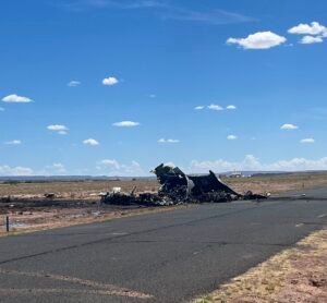 Arizona, United States: A medical transport aircraft crashed while attempting to land at Chinle Municipal Airport on the Navajo Nation, killing all four people on board, officials said Tuesday. According to the Associated Press, the twin‑engine Beechcraft King Air 300, operated by Albuquerque‑based CSI Aviation, had been dispatched to Chinle to pick up a critically ill patient from the Indian Health Service hospital. It went down at about 12:40 p.m. local time on August  5 while on approach and caught fire on impact, leaving the aircraft completely destroyed. Emergency crews from the Navajo Nation police and fire departments quickly responded to the scene, securing the crash site and temporarily closing Chinle Municipal Airport. The National Transportation Safety Board (NTSB) and the Federal Aviation Administration (FAA) have begun investigating the crash. Officials said the investigation will examine flight data, maintenance logs, weather conditions, and crew qualifications to determine the cause of the accident. CSI Aviation confirmed to AZ Family that the aircraft was carrying two pilots and two healthcare providers at the time of the crash. There were no survivors. The identities of the victims have not yet been released pending notification of their families. It also issued a statement cited by People magazine, saying, “We are heartbroken by the loss of our colleagues and partners in medical service and extend our deepest sympathies to their families.” Navajo Nation President Buu Nygren expressed condolences following the tragedy, describing it as “a devastating loss for our Nation and for the families of those who dedicated their lives to helping others,”. He highlighted the crucial role medical flights play in remote tribal communities, where air transport often serves as a lifeline for critically ill patients. No patient was on board at the time of the incident. The aircraft had been dispatched to transport a critical patient to a higher‑level medical facility. Officials noted that the names of the victims will be released once families have been notified. A preliminary report from the NTSB is expected within two weeks, though a full investigation may take months.