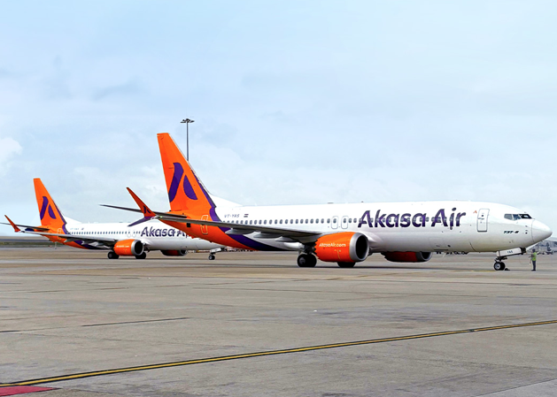 New Delhi, India: India’s youngest airline, Akasa Air, has completed three years of commercial operations and unveiled plans to expand its international footprint into South Asian Association for Regional Cooperation (SAARC) nations and the Association of Southeast Asian Nations (ASEAN) region in the coming years. The Mumbai-based carrier, which operated its maiden flight on August 7, 2022, has grown into a network covering 28 destinations, 23 domestic and five international cities, including Abu Dhabi, Kuwait, Doha, Riyadh, and Jeddah. The airline said it aims to leverage upcoming infrastructure at Navi Mumbai International Airport and Noida International Airport to deepen its domestic network and support long-haul regional routes. Akasa Air has carried more than 19 million passengers since inception, including over 8 million in the last 12 months alone. The airline has recorded a consistent load factor above 87 percent and completed over 100,000 departures more than 3,800 of which were international flights. In addition, the carrier has transported over 131,000 tonnes of cargo and secured partnerships with more than 1,150 corporate clients. The airline currently operates a fleet of 30 Boeing 737 MAX aircraft in 189- and 197-seat configurations. Orders include additional Boeing 737 MAX 8, MAX 200, and MAX 10 aircraft, which will be inducted over the next several years. Speaking to The Times of India Akasa Air founder and chief executive officer Vinay Dube said Boeing’s production output is “gradually returning to its historic production strength” after a prolonged slowdown, adding that this will allow the airline to receive deliveries on schedule and support its growth strategy. In the financial year ending March 2025, Akasa Air reported a 49 percent year-on-year increase in revenue and a 48 percent rise in available seat kilometres. The airline has set a target of increasing capacity by over 30 percent in the current fiscal year. The carrier also entered into a codeshare agreement with Etihad Airways in March 2025, enabling passengers to book combined itineraries across both networks. The partnership is expected to strengthen connectivity to the Middle East and beyond, while providing a platform for future route expansions into Southeast Asia. Industry analysts note that Akasa’s measured but ambitious growth contrasts with the more aggressive early expansions attempted by some of its predecessors in India’s low-cost segment. With South and Southeast Asia’s aviation markets projected to grow significantly in the next decade, Akasa Air’s entry into these regions could place it in direct competition with established carriers such as AirAsia, Batik Air, SriLankan Airlines, and Malindo Air. The airline’s leadership maintains that its strategy focuses on disciplined growth and service quality. Akasa Air’s third anniversary underscores its rapid ascent in India’s aviation sector, driven by operational efficiency, prudent fleet expansion, and targeted market entry.
