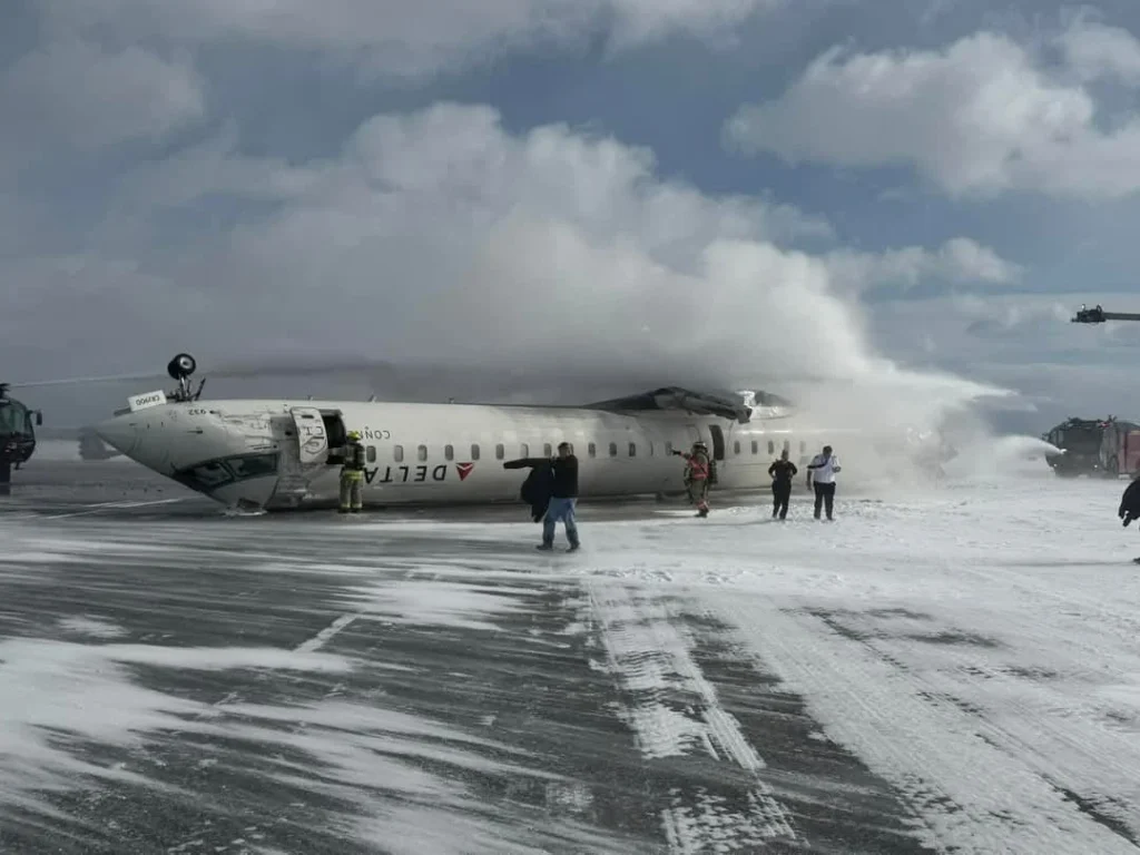 Detroit, United States: A Detroit-based flight attendant has filed a $75 million lawsuit against Delta Air Lines and its regional carrier Endeavor Air, alleging negligence and “human error” in connection with a February crash landing at Toronto Pearson International Airport that left her severely injured. According to court documents filed in the U.S. District Court for the Eastern District of Michigan, Vanessa Miles, 39, claims she sustained life-altering injuries when Delta Connection Flight 4819 operated by Endeavor Air landed hard, flipped over, and briefly caught fire on February 17, 2025. She was traveling as a “deadheading” crew member, repositioning to another assignment, when the accident occurred. The Bombardier CRJ-900 regional jet was arriving from Detroit Metropolitan Wayne County Airport with 80 people on board, including four crew members and 76 passengers. Preliminary findings from the Transportation Safety Board of Canada indicate the aircraft descended too rapidly during final approach, causing a landing gear collapse that led to the jet overturning on the runway. Twenty-one people were injured, there were no fatalities. In its initial report, the TSB noted that the aircraft’s emergency locator beacon failed to activate and that evacuation slides did not function as intended. Passengers and crew evacuated through damaged exits while the aircraft emitted smoke. Miles alleges Delta and Endeavor Air engaged in gross negligence by assigning an inexperienced captain to the flight and rushing pilot training to cut costs. The lawsuit claims both airlines failed to provide adequate safety equipment, citing the non-deployment of evacuation slides and poor in-cabin communication during the emergency. Court filings state that Delta and Endeavor “chose profit over safety” and ignored critical safety protocols, putting crew and passengers at “unnecessary and extreme risk.” Miles says she suffered a traumatic brain injury, a fractured shoulder, spinal and knee injuries, chemical burns, post-traumatic stress disorder, and ongoing anxiety and depression. She claims these injuries have ended her career in aviation. Delta Air Lines has declined to comment on the lawsuit, citing pending litigation, but stated it is cooperating fully with the TSB investigation. The airline has defended the training and certification of both the captain and first officer, saying that safety is its top priority. Endeavor Air has not issued a public statement. The TSB’s full investigation is expected to take several more months and is examining flight data recorders, crew training logs, and maintenance history to determine the exact sequence of events that led to the hard landing and runway overturn.