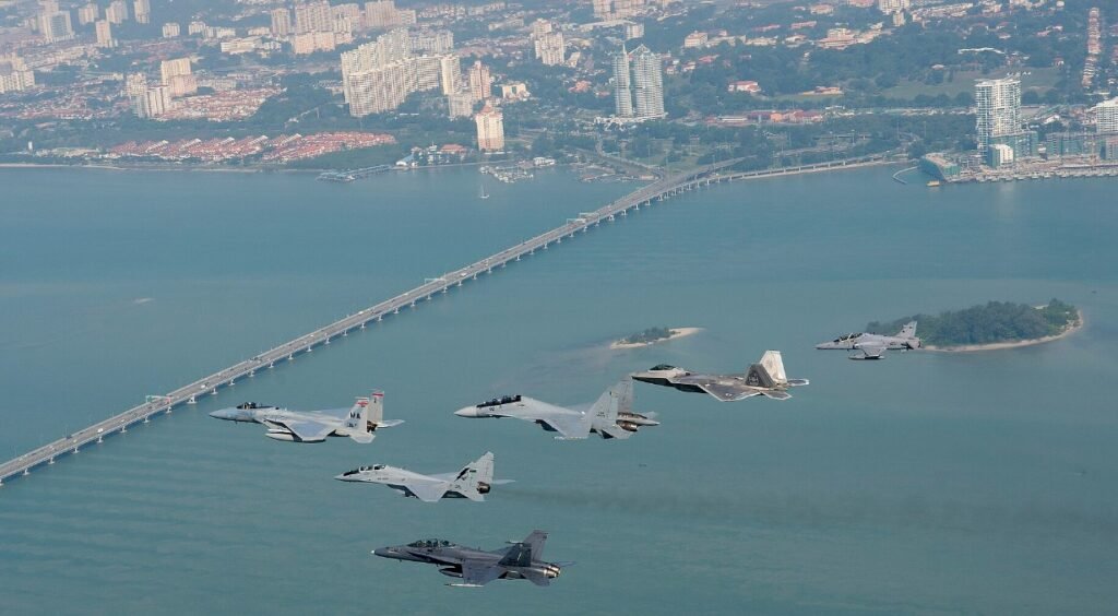Kuantan, Malaysia: A Royal Malaysian Air Force (RMAF) F/A-18D Hornet fighter jet caught fire during take-off at Sultan Haji Ahmad Shah Airport on Thursday night, prompting both pilots to eject seconds before the aircraft crashed. The incident, which occurred around 9:05 pm, temporarily shut down the airport’s runway and disrupted several commercial flights. The RMAF confirmed in a statement that the twin-seat Hornet suffered a fire during its take-off roll at Kuantan Air Base. “Both pilots successfully ejected and were immediately transported to Tengku Ampuan Afzan Hospital for medical observation,” the Air Force said. Witnesses described the terrifying moment as the aircraft burst into flames, sending smoke billowing into the night sky. One resident said that two loud explosions “sounded like missile strikes” and could be heard nearly a kilometre away. A video of the incident, widely circulated on social media, shows the Hornet engulfed in flames as it attempted to lift off the runway before both crew members ejected. The Civil Aviation Authority of Malaysia (CAAM) declared a temporary “Code Black” runway closure following the accident. In a statement CAAM said the runway would remain shut until 1 pm on Friday, August 22, to facilitate debris clearance and safety checks. The closure affected several scheduled services, including Malaysia Airlines flights MH1268 and MH1269, and Scoot flights TR0470 and TR0471. Passengers were advised to check with their airlines for rebooking arrangements. Prime Minister Datuk Seri Anwar Ibrahim extended his well-wishes to the pilots and urged a comprehensive investigation into the cause of the fire. “This incident must be studied thoroughly to ensure the safety of our airmen and the reliability of our defence assets,” Anwar said, as quoted by Malay Mail. The RMAF has launched a formal probe into the accident. No casualties were reported on the ground, and authorities confirmed that the fire was contained within the air base perimeter. The Boeing F/A-18D Hornet is one of the RMAF’s frontline multirole fighters, acquired in the 1990s. The aircraft has seen extensive service, including participation in regional exercises and maritime patrols. The fleet is currently undergoing phased upgrades as part of Malaysia’s defence modernisation plan. While the immediate priority remains the health of the two aircrew, the investigation will focus on determining whether a mechanical failure, engine malfunction, or other technical issues caused the fire. The findings are expected to inform future operational safety measures for the RMAF’s combat fleet. In a separate incident a month ago, five police officers were injured when their AS355N helicopter crashed into the Pulai River during a nuclear security exercise in Johor. Two officers remain in critical condition and are receiving respiratory support in the Intensive Care Unit at Sultanah Aminah Hospital. The remaining three officers are stable. The Civil Aviation Authority of Malaysia (CAAM) confirmed the crash occurred near the Malaysian Maritime Enforcement Agency (MMEA) Jetty in Gelang Patah.