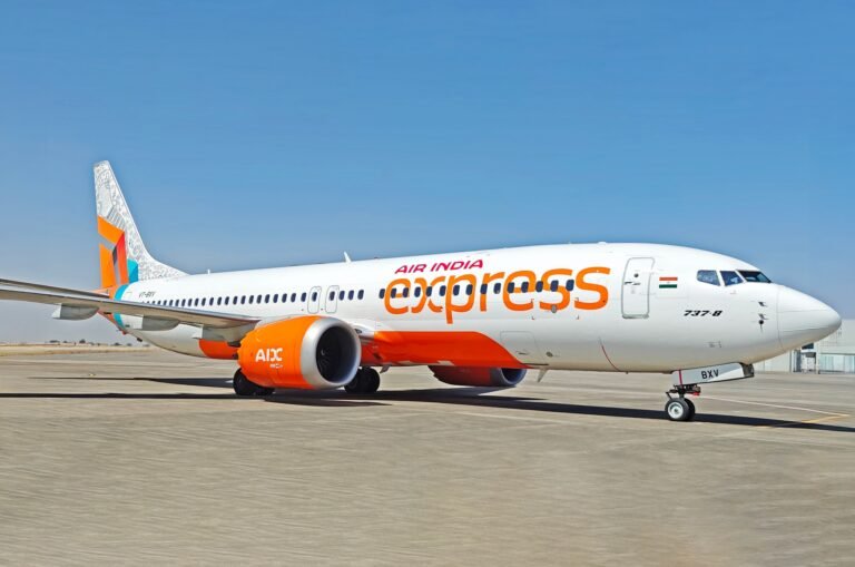 Varanasi, India: A Bengaluru–Varanasi Air India Express flight sparked a major security scare on Monday after a passenger allegedly attempted to access the cockpit mid-air, prompting the crew and security agencies to take swift action. The incident occurred on Flight IX-1086, which departed Kempegowda International Airport in Bengaluru at around 8:00 am and landed safely at Varanasi’s Lal Bahadur Shastri Airport shortly after 10:25 am. According to initial reports, a male passenger approached the cockpit door while apparently searching for the lavatory. Eyewitnesses told investigators that he tried operating the cockpit entry mechanism, which is controlled by a keypad and passcode system. Although early reports suggested the individual may have entered the correct code, sources told The Indian Express that the attempt was unsuccessful and the cockpit door remained secure. The captain, alerted to the unusual activity, immediately blocked access and reinforced cockpit security measures. Cabin crew quickly escorted the passenger away from the cockpit area, following standard aviation safety procedures. On landing in Varanasi, the Central Industrial Security Force (CISF) detained not only the passenger but also eight individuals traveling with him. The group of nine was handed over to Phulpur police for further questioning to determine intent and establish whether the act was accidental or deliberate. Air India Express confirmed the incident but stressed that flight safety and security protocols were never compromised. “Our crew acted promptly in line with standard operating procedures, and the cockpit remained secure throughout,” the airline said in a statement. The Directorate General of Civil Aviation (DGCA) has been notified, and officials are assessing whether the incident qualifies as “Level-3 unruly behaviour,” the highest category under India’s Civil Aviation Requirements. Such classification could result in strict penalties, including the possibility of the passenger being placed on a no-fly list.