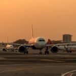 New Delhi, India: A new report by Knight Frank, forecasts a remarkable rise of almost 50% in India’s annual air passenger traffic over the next five years. Passenger numbers are projected to escalate from 412 million in FY25 to 600 million by FY30. According to the report, this substantial jump will drive a sharp increase in aeronautical revenues, driven by both higher passenger counts and enhanced spending per traveler. A major highlight of the analysis involves non-aeronautical revenue streams which include retail, food and beverage, duty-free shopping, parking, advertising, and real estate leasing. Airports operating under the public–private partnership (PPP) model are pivotal: while they handle 64% of India’s total air traffic, they generate a dominant 87% of the nation’s non-aero revenue. The report also spotlights the performance of India’s busiest airports, Mumbai Airport earns approximately USD 20.1 per passenger from non-aero sources. Delhi Airport closely trails with about USD 18.1 per passenger. These numbers are impressively close to global aviation giants like London Heathrow (USD 21.6) and Tokyo Haneda (USD 19.9). Knight Frank's analysis emphasizes that India’s airports are now at a strategic crossroads. With passenger volumes expected to soar to 600 million by FY30, financial sustainability will increasingly depend on diverse revenue models. The report urges airport developers and operators to move beyond traditional infrastructure approaches and adopt the concept of aerocities integrated commercial hubs encompassing retail, hospitality, leasing, and other services turning airports into urban growth engines, not just transit points. The projected surge in air travel offers both significant opportunities and challenges. Operators must balance capacity expansion with revenue diversification to ensure long-term resilience as passenger numbers climb.