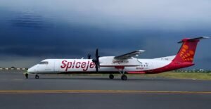 Mumbai, India: A major aviation scare unfolded on Friday afternoon when a SpiceJet Bombardier Q400 aircraft operating flight SG 2906 from Kandla to Mumbai lost one of its main landing gear wheels shortly after take-off. The aircraft, carrying 75 passengers and crew, landed safely at Chhatrapati Shivaji Maharaj International Airport (CSMIA) under full emergency protocol, averting a potential disaster. According to airport authorities at Kandla, air traffic controllers spotted an object falling off the aircraft during take-off around 2:38 pm. Upon closer inspection, officials confirmed that it was the outer wheel of the right rear landing gear, along with metal rings that rolled off the runway. The parts were later recovered for investigation. Despite the wheel loss, the pilots continued to Mumbai after coordinating with air traffic control. A full emergency was declared at Mumbai airport, where firefighting and rescue teams were positioned near the runway. The aircraft landed at 3:51 pm on Runway 27, taxied under its own power, and parked safely. All passengers disembarked without incident. A SpiceJet spokesperson confirmed the incident, stating that the airline is cooperating with the Directorate General of Civil Aviation (DGCA) for a detailed probe. “The safety of our passengers and crew remains our highest priority. The affected aircraft has been grounded pending thorough inspection,” the airline said in a statement. Aviation experts suggest several possible causes for such a wheel detachment, including failure of the locking mechanism, loose axle nuts, bearing issues, or material fatigue. The Q400’s landing gear has dual wheels on each side, which allowed the pilots to land with reduced but adequate braking capability. Operations at Mumbai airport resumed shortly after the aircraft was cleared from the runway. No further delays were reported. The DGCA has initiated an inquiry to determine whether the incident was due to a maintenance lapse, manufacturing defect, or operational issue. Preliminary findings are expected in the coming days.
