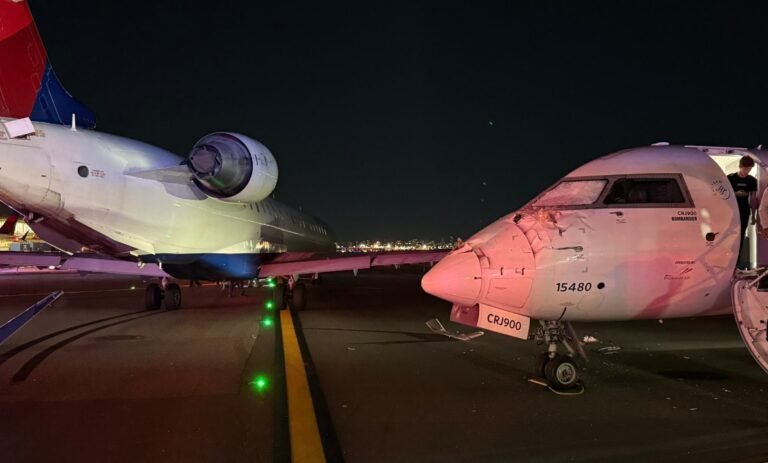 New York, United States: A low-speed collision between two Delta Connection regional jets disrupted operations at LaGuardia Airport on Wednesday night, injuring a flight attendant and damaging both aircraft. The incident occurred when Delta Connection Flight 5155, operated by Endeavor Air and scheduled to depart for Roanoke, Virginia, struck the nose of Delta Connection Flight 5047 arriving from Charlotte, North Carolina. The right wing of the departing CRJ-900 clipped the cockpit section of the arriving aircraft. The collision shattered cockpit windows and damaged the forward fuselage of the Charlotte flight. A cabin crew member on board sustained a knee injury and was taken to a local hospital. No passengers were hurt. The Port Authority of New York and New Jersey confirmed that airport operations continued without major disruption. The Endeavor flight 5155 was carrying 32 people including 28 passengers and 4 crewmembers whereas Endeavor flight 5047 was carrying 61 people in which 57 were passengers and 4 crewmembers, all passengers were safely deplaned and transported by bus to the terminal, where Delta arranged hotel accommodation, meals, and rebooking support. The NTSB has dispatched a team of ten investigators and recovered flight recorders from both aircraft for analysis. The FAA stated that Flight 5155 had been instructed to hold position before the collision, but the exact circumstances remain under investigation. The focus will include taxiway intersection layout, air traffic control instructions, and pilot decision-making. Flights resumed on schedule Thursday morning, with no further delays.