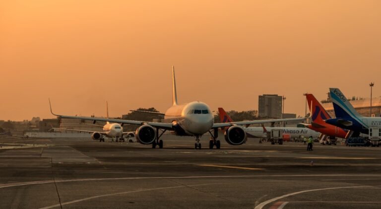 New Delhi, India: ICRA has revised its domestic air passenger growth projection for FY26 to 4–6%, down from the previous estimate of 7–10%. This adjustment follows a modest 0.3% year-on-year increase in passenger traffic to 13.17 million in August 2025. The revised forecast anticipates a total of 172–176 million domestic passengers for the fiscal year, compared to 165.4 million in FY25. International air traffic growth estimates have also been reduced to 13–15% for FY26, from the earlier projection of 15–20%. Factors contributing to this downgrade include geopolitical tensions affecting flight operations, decreased travel confidence following a recent aircraft accident, and global trade challenges such as the impact of U.S. tariffs. Consequently, ICRA projects the aviation sector's net losses to widen to ₹9,500–10,500 crore in FY26, up from ₹5,500 crore in FY25. This increase is attributed to slower passenger growth amid rising aircraft deliveries and operational hurdles. Industry capacity also declined, with capacity deployment in August 2025 dropping 5.8% compared to the same month last year. Supply chain disruptions and engine issues, particularly involving Pratt & Whitney engines, have led to approximately 133 aircraft being grounded as of March 31, 2025, accounting for 15–17% of the total industry fleet. Despite a decrease in aviation turbine fuel (ATF) prices, cost pressures persist due to the dollar-denominated nature of key operating expenses, including fuel, aircraft leases, and maintenance. These factors continue to impact airlines' profitability. ICRA notes that while some carriers benefit from strong parental support and adequate liquidity, others may face challenges in maintaining credit metrics and liquidity profiles in the near term.