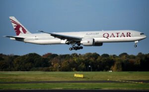 Ahmedabad, India: A Qatar Airways flight operating from Doha to Hong Kong declared a full emergency on Tuesday afternoon and made a precautionary landing at Ahmedabad’s Sardar Vallabhbhai Patel International Airport (SVPIA) after the aircraft reportedly experienced a sudden loss of cabin pressure. According to airport officials, Flight QR 816, operated by a Boeing 777-300ER (registration A7-BOB), was cruising through Indian airspace when the crew detected abnormal cabin pressure levels. At 2:12 p.m. (IST), Ahmedabad Air Traffic Control declared a full emergency, activating standard response protocols and alerting ground services, medical units, and firefighting teams. The aircraft landed safely at 2:32 p.m., and the emergency status was withdrawn six minutes later, once engineers confirmed there was no immediate safety threat. All passengers and crew members onboard were reported safe, with no injuries or medical emergencies. “The aircraft landed safely in Ahmedabad following a technical issue,” a Qatar Airways spokesperson said in a brief statement. “All passengers are being looked after, and the aircraft is currently undergoing maintenance checks before resuming operations.” Airport authorities confirmed that normal flight operations continued uninterrupted during and after the emergency response. Qatar Airways’ engineering team initiated a detailed inspection to determine the cause of the technical fault related to the cabin pressure system. Preliminary assessments suggested a pressurization system malfunction, but the airline has yet to release an official statement on the cause.
