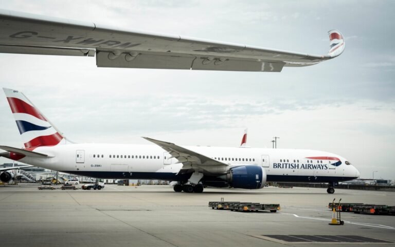 London, United Kingdom: A British Airways flight was canceled at London Heathrow Airport after a ground service vehicle became lodged under a Boeing 787 Dreamliner, causing significant damage and a 24-hour delay. The incident occurred on Monday evening at Terminal 5, where a van operated by Thales, an aviation technology firm, rolled beneath the aircraft's wing after its driver failed to engage the handbrake during pre-departure checks. The vehicle became wedged under the fuselage, leading to the cancellation of Flight BA33 to Kuala Lumpur over safety concerns. Approximately 300 passengers were affected by the cancellation, resulting in a 24-hour delay. They were provided with overnight accommodation while engineers and emergency services assessed the situation. The total cost of the incident, including safety checks, compensations, and revised crew schedules, was estimated at £100,000. British Airways confirmed the delay and provided accommodations, while Thales did not comment on the incident. For passengers affected by flight cancellations, British Airways offers assistance with delays, cancellations, and refunds. Passengers are advised to update their contact information in "Manage My Booking" to receive timely updates.