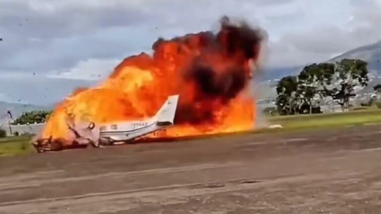 San Cristóbal, Venezuela: A twin-engine Cheyenne aircraft crashed shortly after takeoff from Paramillo Airport in the mountainous state of Táchira on Wednesday, killing two people on board. Authorities say a possible tire explosion during takeoff may have triggered the disaster. According to eyewitnesses, the aircraft lifted off from the runway and moments later veered sharply to the left before crashing and erupting into flames. Bystanders and airport personnel rushed to the scene but were unable to rescue the occupants as the plane was engulfed by fire. Images and video circulating on social media show thick plumes of black smoke rising from the crash site. The charred wreckage was located near the perimeter of Paramillo Airport, a regional hub serving San Cristóbal in western Venezuela. Local media reports suggest that one of the aircraft’s main landing-gear tires may have burst during the takeoff roll, causing a loss of control. However, aviation authorities have not confirmed the cause. The country’s Civil Aviation Authority has opened a formal investigation to determine whether a mechanical malfunction, maintenance failure, or pilot error contributed to the crash. The victims’ identities have not yet been released pending family notification. Officials confirmed that recovery teams and investigators have secured the site for forensic and technical analysis. Paramillo Airport’s short runway and surrounding mountainous terrain make it a challenging airfield for pilots, particularly during takeoff and climb-out. Aviation experts note that tire or wheel-well failures during high-speed ground roll can lead to catastrophic structural damage or fuel-line ruptures if debris strikes vital components. While the cause remains unverified