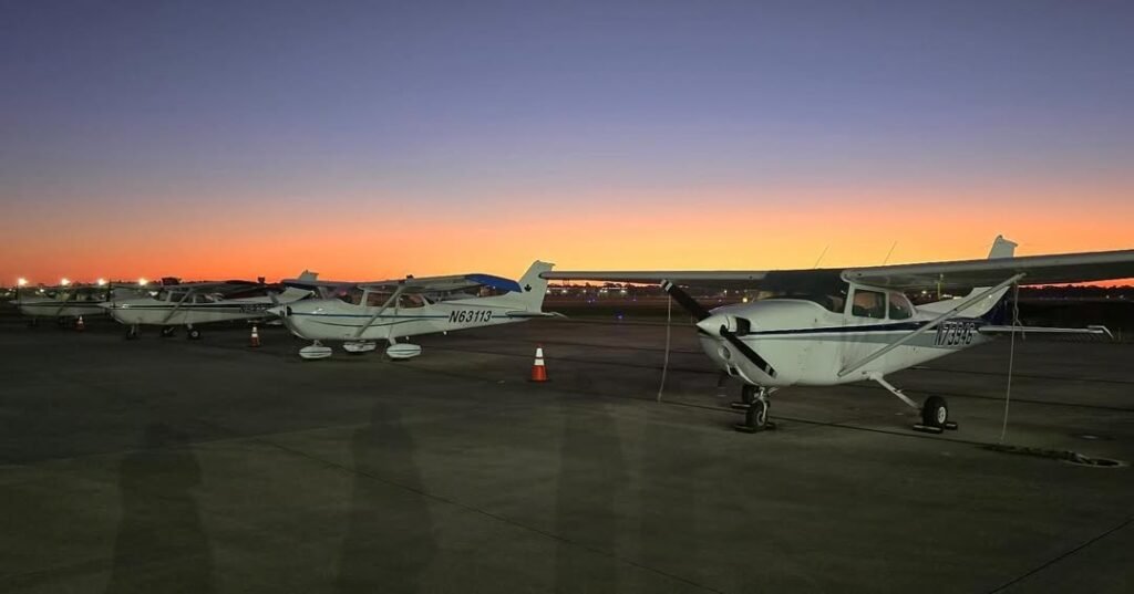 Gulfport, United States: A small instructional aircraft from Apollo Flight Training and Aircraft Management plunged into Lake Pontchartrain Monday night after losing contact with air traffic controllers, authorities and the flight-school owner said. Two people on board a flight instructor and a student working toward their commercial license are presumed dead. The aircraft, a single-engine Cessna, departed from Million Air in Gulfport around 5:45 p.m. Monday, bound for a training approach to New Orleans Lakefront Airport. Radio contact was lost around 6:23–6:40 p.m., roughly four miles offshore over the lake. Search efforts by the United States Coast Guard (USCG), along with local agencies including wildlife and fisheries and parish sheriff’s offices, began shortly after the plane disappeared from radar. A MH-60 helicopter and a 29-foot Coast Guard boat were deployed from the New Orleans station. During the overnight search, crews recovered debris believed to belong to the aircraft including what appeared to be a seat cushion, and later what may have been part of the landing gear. Divers also reported a sonar hit in the search area, and teams observed water discoloration consistent with a crash. The owner of Apollo Flight Training, Michael Carastro, described the crash as “an unimaginable tragedy.” He confirmed the debris matched distinctive characteristics of their Cessna, and said based on maintenance and inspection records, mechanical failure appears unlikely. He also stated no distress call was received prior to the crash. Carastro noted the instructor aboard was “highly qualified,” with between 1,200 and 1,300 flight hours, and the student was working toward a commercial/instrument rating. He added that flying over water, particularly at night, carries additional risks: “you don’t have clear horizons, you get vertigo,” making spatial disorientation a possibility. But Carastro refrained from speculating on the cause until investigators completed their work. At present, the wreckage has not been recovered. The USCG, local agencies, and volunteer organizations continue search operations. Investigations by the Federal Aviation Administration (FAA) and the National Transportation Safety Board (NTSB) have been initiated; authorities emphasize it is premature to draw conclusions about the cause of the crash.