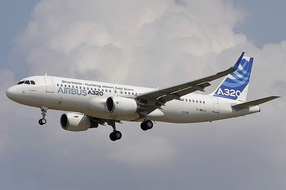 Toulouse, France: Airbus has issued an urgent global recall of its A320 family aircraft after a serious mid-air flight-control incident raised safety concerns for thousands of jets worldwide. The recall directive affects roughly 6,000 aircraft, representing over half of the A320 fleet currently in operation, making it one of the most extensive fleet actions in recent aviation history. The action was prompted by an incident involving a JetBlue A320 on 30 October 2025, during which the aircraft experienced a sudden, uncommanded drop in altitude, forcing the crew to perform an emergency landing. While the flight landed safely, several passengers sustained minor injuries, and the event triggered an immediate investigation by Airbus and aviation safety authorities. Investigators concluded that intense solar radiation may have temporarily corrupted critical avionics data, affecting the aircraft’s flight-control systems. Importantly, the issue is software-related rather than structural, but it exposed vulnerabilities in the aircraft’s data-handling and flight-control architecture under extreme environmental conditions. In response, Airbus has mandated all operators apply a critical software update that reverts the flight-control systems to a proven, stable configuration. For most aircraft, the update can be performed within a few hours and the jets can return to service immediately. However, some older or heavily affected aircraft require hardware replacements to fully resolve the issue, which could keep them grounded for several days. The recall has already disrupted flight schedules worldwide, as airlines scramble to comply with the directive. Major operators, including IndiGo, Air India, American Airlines, Jetstar, and other carriers in Europe and Asia, have issued warnings of potential delays, cancellations, and rescheduling, especially for flights operated with A320-family aircraft. The European Union Aviation Safety Agency (EASA), along with national aviation regulators, is closely monitoring compliance and providing guidance to ensure safety standards are maintained. Airbus has emphasized that passenger safety remains its highest priority and has pledged full cooperation with airlines to minimize operational disruption. Passengers flying on affected aircraft are advised to check directly with their airlines for updates. Airlines have indicated that most A320s will resume service within days, although some delays are expected to persist in the short term, particularly in regions with a high density of A320 operations. The Airbus A320 family, widely regarded as the backbone of short- and medium-haul commercial aviation, continues to operate safely in most circumstances. However, this recall represents a rare but significant safety precaution, emphasizing the need for continuous vigilance, maintenance, and software management in the era of highly automated aircraft.