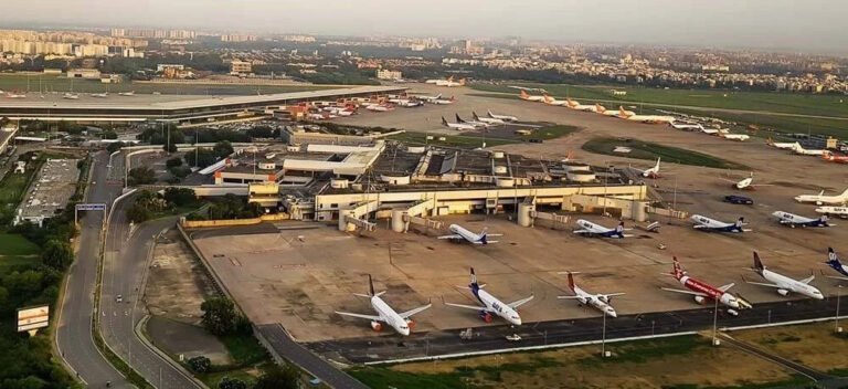 New Delhi, India: India’s aviation industry is bracing for a difficult FY2026, with ICRA estimating sector-wide losses to climb to Rs 95–105 billion, almost double the Rs 55 billion loss expected in FY2025. Softening passenger growth, upcoming fleet inductions and ongoing global and domestic disruptions are set to pressure financial performance. Even so, ICRA has maintained a stable outlook for the year, supported by steady travel demand, though influenced by cross-border tensions, accident-related caution and tariff-linked challenges on the commercial side. Domestic passenger traffic in October 2025 reached 142.8 lakh, up 4.5% from October 2024 and 12.9% higher than September 2025. Capacity deployment grew 1.7% year-on-year to 99,816 departures, with passenger load factor rising to 84.7%, compared with 82.4% a year earlier. For April–October 2025, domestic traffic stood at 944.5 lakh, a 1.6% year-on-year increase. ICRA expects full-year FY2026 domestic travel to grow 4–6%, reaching 172–176 million passengers. International traffic carried by Indian airlines rose 5.8% year-on-year in September 2025, touching 28.3 lakh, though sequentially down by 5.7%. In H1 FY2026, international traffic reached 175.6 lakh, marking 9.1% growth. ICRA projects further expansion of 13–15% in FY2026. Aviation turbine fuel (ATF) remains a key cost concern. ATF prices in November 2025 were 4.4% higher year-on-year and 0.8% higher month-on-month. FY2025 had seen average ATF prices fall to Rs 95,181 per KL, about 8% lower year-on-year, but recent months have reversed that relief. Fuel constitutes 30–40% of airline operating expenses, while 35–50% of major costs are dollar-linked. The rupee’s depreciation in Q2 FY2026 led to notable forex losses for several carriers, though most remain unrealised. Fleet shortages persist. Pratt & Whitney engine problems and broader supply-chain delays resulted in around 133 aircraft being grounded across various airlines by March 2025, representing 15–17% of total industry capacity. IndiGo had 70 aircraft grounded in March 2024 due to powder-metal contamination, which reduced to about 40 by September 2025. Go Airlines, hit by similar issues, eventually grounded half its fleet in FY2024 and suspended operations. These constraints have increased operating costs through replacement leases, poorer fuel efficiency and higher spot-rental rates. Despite strong PLFs and firmer yields, profitability remains limited. The industry’s interest coverage ratio is expected to remain at 1.5–1.7 times for FY2026. Large carriers benefit from parent backing, while others continue to face liquidity stress and stretched balance sheets. The DGCA has proposed new passenger-centric norms allowing customers to cancel or modify tickets within 48 hours of booking without charges, provided the travel date is beyond five days (domestic) or fifteen days (international). Refunds are to be processed within 21 working days.
