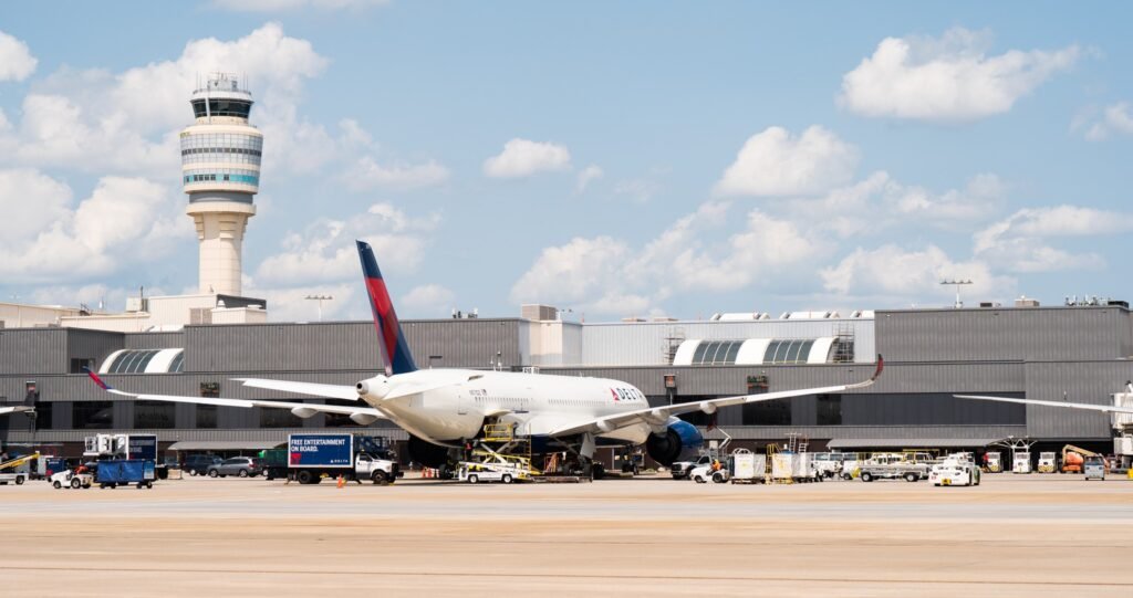Washington, D.C, United States: The Federal Aviation Administration (FAA) has issued an emergency order mandating a temporary 10 percent reduction in flight operations at 40 of the nation’s busiest airports. The move, announced by U.S. Transportation Secretary Sean P. Duffy and FAA Administrator Bryan Bedford, is aimed at maintaining safety across the national airspace system as the government shutdown enters its second month. FAA Cites Safety Strain, Staffing Pressures Since the shutdown began, thousands of air traffic controllers have worked without pay, triggering severe staffing shortages and operational stress across major hubs. The FAA said it recorded 2,740 delays over the past weekend alone, reflecting growing pressure on the system. “My department has many responsibilities, but our number one job is safety. This isn’t about politics – it’s about assessing the data and alleviating building risk in the system as controllers continue to work without pay,” Secretary Duffy said. “It’s safe to fly today, and it will continue to be safe to fly next week because of the proactive actions we are taking.” Administrator Bedford added, “We are seeing signs of stress in the system, so we are proactively reducing the number of flights to make sure the American people continue to fly safely. The FAA will continue to closely monitor operations and will not hesitate to take further action to make sure air travel remains safe.” Summary of the FAA Emergency Order According to the directive: A 4% reduction in domestic operations takes effect Friday, Nov 7, ramping up to 6% by Nov 11, 8% by Nov 13, and 10% by Nov 14. International flights are exempt, allowing airlines discretion to decide which routes to reduce. Airlines must issue full refunds for canceled flights, though they are not required to cover secondary costs, consistent with federal policy for government-related disruptions. The FAA also temporarily: Prohibits visual flight rule (VFR) approaches at affected facilities with staffing triggers. Limits commercial space launches and reentries to the hours of 10 p.m.–6 a.m. local time. Suspends parachute operations and aerial photography missions near impacted facilities. The agency said the measures were guided by safety data and voluntary reports from pilots and controllers showing mounting fatigue and system stress. Impact on Travelers Officials emphasized that the airspace remains safe but acknowledged the steps are preventive and temporary. Airlines are adjusting schedules to comply with the phased reductions, focusing cancellations during peak domestic hours. The FAA said any expansion or rollback of the cuts will be driven by real-time safety data. Official List of Affected Airports ANC – Ted Stevens Anchorage International Airport ATL – Hartsfield-Jackson Atlanta International Airport BOS – Boston Logan International Airport BWI – Baltimore/Washington International Airport CLT – Charlotte Douglas International Airport CVG – Cincinnati/Northern Kentucky International Airport DAL – Dallas Love Field DCA – Ronald Reagan Washington National Airport DEN – Denver International Airport DFW – Dallas/Fort Worth International Airport DTW – Detroit Metropolitan Wayne County Airport EWR – Newark Liberty International Airport FLL – Fort Lauderdale/Hollywood International Airport HNL – Honolulu International Airport HOU – William P. Hobby Airport IAD – Washington Dulles International Airport IAH – George Bush Houston Intercontinental Airport IND – Indianapolis International Airport JFK – New York John F. Kennedy International Airport LAS – Las Vegas McCarran International Airport LAX – Los Angeles International Airport LGA – New York LaGuardia Airport MCO – Orlando International Airport MDW – Chicago Midway International Airport MEM – Memphis International Airport MIA – Miami International Airport MSP – Minneapolis–St. Paul International Airport OAK – Oakland International Airport ONT – Ontario International Airport ORD – Chicago O’Hare International Airport PDX – Portland International Airport PHL – Philadelphia International Airport PHX – Phoenix Sky Harbor International Airport SAN – San Diego International Airport SDF – Louisville International Airport SEA – Seattle–Tacoma International Airport SFO – San Francisco International Airport SLC – Salt Lake City International Airport TEB – Teterboro Airport TPA – Tampa International Airport Looking Ahead The FAA said it will continue to review safety metrics daily to determine whether further cuts or operational adjustments are needed. “Safety reporting is showing us where the stress points are,” the agency said. “This order will remain in effect only as long as necessary to maintain system stability.” Passengers traveling through the affected airports are urged to monitor airline communications for updated flight schedules and potential waivers.