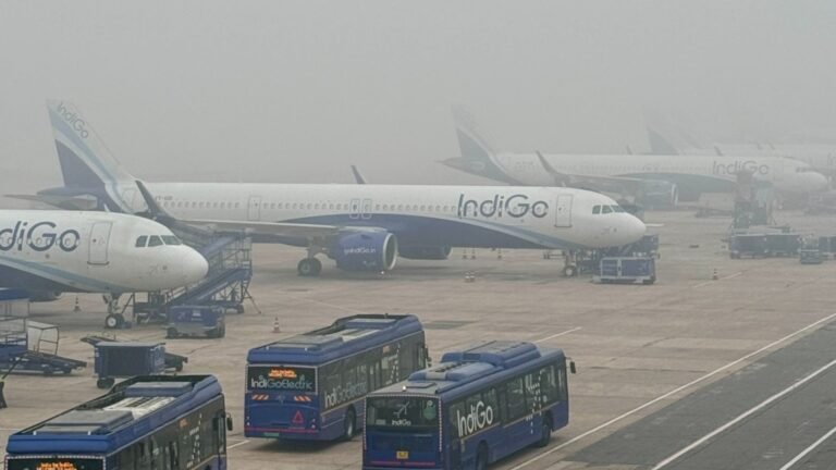 New Delhi, India: India’s aviation watchdog has imposed a ₹20 lakh penalty on IndiGo for violating instrument flight procedure norms at Udaipur’s Maharana Pratap Airport, marking another compliance setback for the country’s largest airline. According to a regulatory filing by InterGlobe Aviation, the parent company of IndiGo, the Directorate General of Civil Aviation (DGCA) found the airline in breach of rules after it implemented a Standard Instrument Departure (SID) and Instrument Flight Procedure (IFP) that had been internally formulated by the company rather than issued by the Airport Authority of India (AAI), the only authorised body to publish such procedures. The DGCA stated that the airline’s actions violated Rule 133A of the Aircraft Rules, 1937, along with provisions of Civil Aviation Requirement (CAR) Section 9, Series C, Part I, specifically paragraphs 2.2 and 2.34, which mandate strict adherence to officially promulgated instrument procedures. InterGlobe confirmed that the communication from the DGCA was received on 17 November 2025. In its exchange filing, the company noted that the penalty would have “no material impact” on its operations or financial position. Industry observers say the latest order reflects DGCA’s tightening oversight on airlines’ compliance with flight procedures, especially at airports that require strict navigational conformity. Instrument departures and arrivals are critical for maintaining flight safety, particularly in regions with terrain challenges or high-density traffic. The penalty comes weeks after DGCA imposed a ₹40 lakh fine on IndiGo for using non-qualified full-flight simulators to train pilots operating to Category C airports, including Leh, Calicut, and Kathmandu. The investigation revealed that nearly 1,700 pilots underwent training on simulators that did not meet regulatory standards prescribed for operations into these high-difficulty airports. In that case, DGCA penalised IndiGo’s Director of Training and Director of Flight Operations with individual fines of ₹20 lakh each, citing oversight lapses and deviations from CAR guidelines.