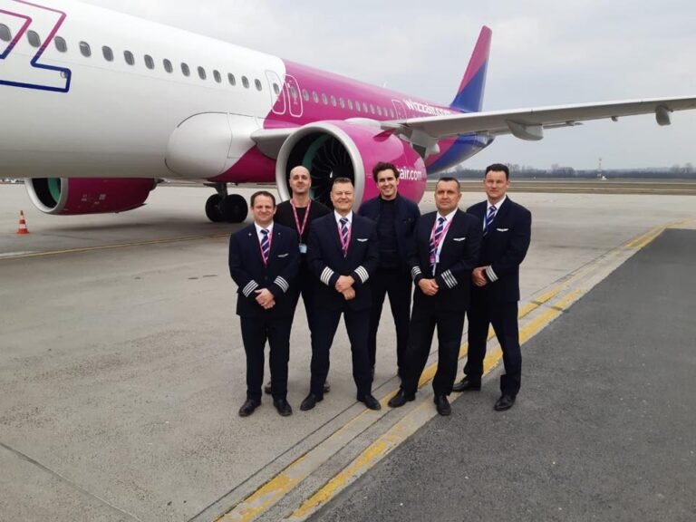 Dublin, Ireland: European budget airline Wizz Air has announced an ambitious recruitment and training campaign to prepare up to 1,200 new pilots by 2028, including 240 UK-based cadets, as part of its long-term growth strategy to expand its fleet and secure a steady supply of trained flight crew. The Budapest-headquartered carrier, which operates one of Europe’s youngest fleets, unveiled the initiative through its Wizz Air Pilot Academy, targeting both aspiring aviators and mid-career professionals with no prior flying experience. According to Wizz Air, the recruitment process begins with a six-month selection phase, followed by approximately two years of structured flight training. Successful graduates will then join the airline as Airbus A320/321 First Officers, flying across its extensive European and Middle Eastern network. The programme features an improved financial scheme for tuition fees for successful cadets, although participants are expected to meet certain entry conditions, including holding the right to live and work in one of Wizz Air’s operational base countries. Trainees must also be at least 18 years old, fluent in English, and capable of swimming 50 metres unaided Though Wizz Air currently does not operate commercial flights to or from Ireland, its participation in events such as Pilot Careers Live Dublin reflects its intention to expand its visibility and recruit skilled candidates from Ireland’s established aviation ecosystem. Interested candidates can apply through the airline’s official careers portal careers.wizzair.com by selecting the “Pilot Academy” section. Applicants will undergo a multi-stage assessment process, including aptitude testing, interviews, and simulator evaluations designed to identify candidates with the potential to succeed as professional airline pilots. The academy offers guidance throughout the application process, including access to partner flight schools and approved training organizations (ATOs) that deliver the structured modular and integrated training pathways required for Wizz Air operations. Cadets joining the programme can expect to earn around £40,000 (€46,000) during training, rising to £60,000 (€68,000) upon completion and promotion to First Officer. After gaining experience, pilots may earn £90,000 (€103,000) after two years, with Captains commanding up to £200,000 (€230,000) annually. These figures reflect Wizz Air’s structured career progression system, which allows cadets to move from trainee status to command positions within a few years, a key attraction for career entrants in an industry known for long qualification timelines. Industry analysts note that the initiative is part of Wizz Air’s broader plan to grow its fleet to 500 aircraft by 2030, enabling the airline to carry over 100 million passengers annually. The expansion aligns with Wizz Air’s large Airbus A321neo order book, aimed at boosting efficiency and sustainability. Captain Phil Cullen, Head of Operations and Accountable Manager at Wizz Air UK, said the programme represents a “significant investment in the future of aviation and the UK’s economic landscape,” adding that it creates opportunities for young people seeking stable, long-term careers in aviation.