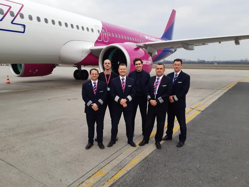 Dublin, Ireland: European budget airline Wizz Air has announced an ambitious recruitment and training campaign to prepare up to 1,200 new pilots by 2028, including 240 UK-based cadets, as part of its long-term growth strategy to expand its fleet and secure a steady supply of trained flight crew. The Budapest-headquartered carrier, which operates one of Europe’s youngest fleets, unveiled the initiative through its Wizz Air Pilot Academy, targeting both aspiring aviators and mid-career professionals with no prior flying experience. According to Wizz Air, the recruitment process begins with a six-month selection phase, followed by approximately two years of structured flight training. Successful graduates will then join the airline as Airbus A320/321 First Officers, flying across its extensive European and Middle Eastern network. The programme features an improved financial scheme for tuition fees for successful cadets, although participants are expected to meet certain entry conditions, including holding the right to live and work in one of Wizz Air’s operational base countries. Trainees must also be at least 18 years old, fluent in English, and capable of swimming 50 metres unaided Though Wizz Air currently does not operate commercial flights to or from Ireland, its participation in events such as Pilot Careers Live Dublin reflects its intention to expand its visibility and recruit skilled candidates from Ireland’s established aviation ecosystem. Interested candidates can apply through the airline’s official careers portal careers.wizzair.com by selecting the “Pilot Academy” section. Applicants will undergo a multi-stage assessment process, including aptitude testing, interviews, and simulator evaluations designed to identify candidates with the potential to succeed as professional airline pilots. The academy offers guidance throughout the application process, including access to partner flight schools and approved training organizations (ATOs) that deliver the structured modular and integrated training pathways required for Wizz Air operations. Cadets joining the programme can expect to earn around £40,000 (€46,000) during training, rising to £60,000 (€68,000) upon completion and promotion to First Officer. After gaining experience, pilots may earn £90,000 (€103,000) after two years, with Captains commanding up to £200,000 (€230,000) annually. These figures reflect Wizz Air’s structured career progression system, which allows cadets to move from trainee status to command positions within a few years, a key attraction for career entrants in an industry known for long qualification timelines. Industry analysts note that the initiative is part of Wizz Air’s broader plan to grow its fleet to 500 aircraft by 2030, enabling the airline to carry over 100 million passengers annually. The expansion aligns with Wizz Air’s large Airbus A321neo order book, aimed at boosting efficiency and sustainability. Captain Phil Cullen, Head of Operations and Accountable Manager at Wizz Air UK, said the programme represents a “significant investment in the future of aviation and the UK’s economic landscape,” adding that it creates opportunities for young people seeking stable, long-term careers in aviation.