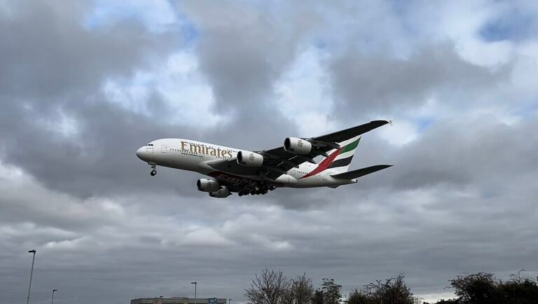 Manchester, United Kingdom: An Emirates Airbus A380 was grounded at Manchester Airport after a fuel truck struck the aircraft during ground operations, forcing the airline to cancel its scheduled return service to Dubai. The aircraft resumed operations after undergoing inspections and repairs, according to multiple aviation industry reports. The incident occurred on 28 November 2025, shortly after the superjumbo had arrived from Dubai operating flight EK17. While parked at the gate during turnaround preparations for its return flight EK18, a fuel truck made contact with one of the aircraft’s Rolls-Royce Trent engines, damaging the engine intake cowling. Initial reports confirmed that the aircraft, registered A6-EVP, sustained visible structural damage to the engine intake area. Despite the impact, no injuries were reported, and airport emergency protocols were not triggered. Due to the damage, Emirates cancelled flight EK18, leaving the aircraft grounded at Manchester for detailed technical inspection. Engineers assessed the aircraft on site to determine whether the damage extended beyond the intake structure. According to follow-up reports, Emirates completed essential repairs within two days. The A380 returned to active service on 30 November 2025, operating as flight EK20 from Manchester to Dubai, restoring normal wide-body operations on the route. Industry analysts noted that while the damage was limited, even minor engine intake deformation on an A380 requires immediate grounding due to strict safety regulations governing wide-body aircraft and high-bypass turbofans. As of the latest update, neither Emirates nor Manchester Airport has released an official statement confirming the root cause of the collision, and no public details have emerged regarding whether the fuel truck driver or ground-handling agency faced disciplinary action.