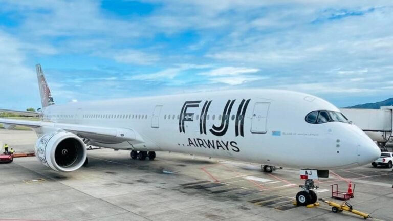 Nadi, Fiji: Fiji Airways has issued a public apology after passengers on an Auckland-bound flight experienced a delay of more than 20 hours, on 20 December, triggering widespread criticism over communication gaps and passenger care during the disruption. The affected flight, scheduled to depart Nadi for Auckland, was delayed due to a combination of operational and safety-related constraints, according to the airline. Fiji Airways confirmed that the aircraft eventually departed after engineers completed the required checks and operational clearances. In a statement, the national carrier said safety considerations remained the overriding factor behind the prolonged delay and stressed that the decision to hold the flight was taken to ensure compliance with aviation safety standards . Passengers, however, described long hours of uncertainty at Nadi International Airport, citing limited information, accommodation challenges, and difficulties accessing timely assistance. Some travellers told local media they were left unclear about departure timelines and support arrangements during the extended wait . Following the incident, Fiji Airways acknowledged shortcomings in its handling of customer communication and said it has begun reviewing its disruption-management procedures. The airline confirmed it is assessing improvements to real-time updates, frontline coordination, and passenger welfare protocols during extended delays . As a goodwill measure, Fiji Airways has offered affected passengers discount vouchers for future travel, while reiterating that safety-driven delays, though rare, can result in unavoidable schedule disruptions . Government officials weighed in as public reaction intensified, with senior leaders acknowledging passenger frustration while backing the airline’s emphasis on safety compliance. Officials noted that operational disruptions must be balanced against strict regulatory and safety obligations in international aviation . The incident has reignited broader discussion in the Pacific aviation sector around airline accountability, crisis communication, and passenger rights during prolonged delays, particularly as regional travel demand continues to rise.