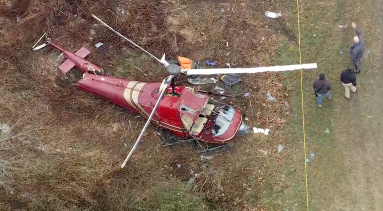 New Jersey, United States: A mid-air collision between two helicopters over Hammonton Municipal Airport in southern New Jersey on Sunday resulted in one fatality and one critically injured pilot, officials confirmed as emergency crews continued their response and federal investigators prepared to launch a full inquiry. The Federal Aviation Administration (FAA) characterized the incident as a mid-air collision between an Enstrom F-28A helicopter and an Enstrom 280C helicopter near the Hammonton Municipal Airport at approximately 11:25 a.m. local time on December 28, 2025. Hammonton Police Chief Kevin Friel said first responders were dispatched following reports of an aviation crash. Video from the scene showed one helicopter spiraling rapidly to the ground before impact, prompting immediate deployment of police, fire and medical units. Fire crews extinguished flames on one of the aircraft. One pilot was pronounced dead at the scene, while the second pilot was transported to a nearby hospital with life-threatening injuries, according to police and fire officials. Authorities have not yet released the names of those involved. The collision occurred in clear weather conditions and was witnessed by local residents, some of whom captured footage showing both helicopters in distress moments before impact. The FAA and the National Transportation Safety Board (NTSB) have launched a joint investigation to determine the sequence of events leading to the crash. Early investigative focus is expected to examine flight paths, pilot communications, and whether both aircraft operated under visual flight rules. A preliminary report may be released within days, though a final probable cause determination could take months. Hammonton, a community of about 15,000 in Atlantic County, lies roughly 35 miles southeast of Philadelphia and is home to general aviation activity at the municipal airport. Several witnesses near the crash site described hearing a loud noise followed by the sudden descent of the aircraft. Local café owner Sal Silipino, familiar with the pilots, said they were regular patrons who often flew together. “It was shocking. I’m still shaking after that happened,” one resident told reporters. Authorities have urged the public to avoid the crash area to allow emergency crews and investigators unobstructed access to the scene. Further updates, including official preliminary findings from the NTSB, are expected as the investigation progresses.
