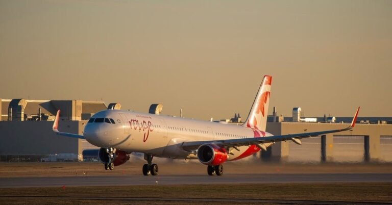 Toronto, Canada: An Air Canada Rouge domestic flight was forced to return to the gate at Toronto Pearson International Airport on December 13, 2025, after a ground crew member became inadvertently trapped in the aircraft’s cargo hold, prompting passengers to alert cabin crew after hearing distressing noises. Flight AC1502, an Airbus A321 bound for Moncton, New Brunswick, had begun taxiing for departure when passengers seated toward the rear reported hearing screaming and banging sounds emanating from beneath the cabin. Several travellers notified flight attendants, who investigated and subsequently halted the aircraft’s progress. In a video shared on social media and verified by local media, the aircraft captain addressed passengers after the taxi was stopped. “I’ve never had that in my life. First time, hopefully first and last,” the pilot said, noting that the trapped individual was safely removed. According to Air Canada, the cargo doors were inadvertently closed while the ground crew member was still inside the hold, and he was discovered only after the plane had already begun to taxi. Emergency procedures were activated, and the aircraft immediately returned to the departure gate. The airline confirmed no injuries were reported and that the employee was freed from the cargo compartment without harm. In a statement to the media, Air Canada said it has “reinforced our procedures with our ground crews” to reduce the likelihood of similar incidents in the future. Passengers described the incident as unsettling. One traveller told CBC that the sounds from the hold were unmistakable and that flight attendants initially checked other areas of the aircraft before determining the source. The flight ultimately did not depart for Moncton as scheduled. Passengers were informed that the delay was beyond the control of the airline and that arrangements would be made for later travel.