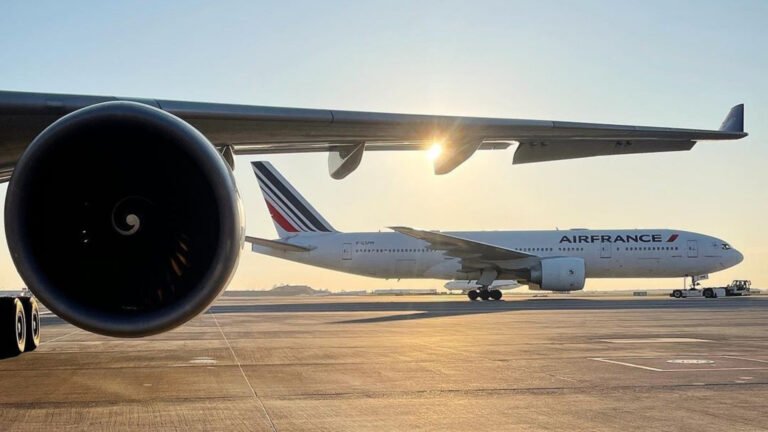 Ashgabat, Turkmenistan: An Air France long-haul service from Bengaluru to Paris was forced to divert to Ashgabat, Turkmenistan, early on January 13, 2026, after one of the aircraft’s engines reported a technical fault mid-flight, leaving passengers stranded for more than 15 hours before onward travel arrangements could be made. Flight AF191A, operated with a Boeing 777-200ER, departed Kempegowda International Airport (BLR) at 11:22 pm IST on January 12 bound for Paris Charles de Gaulle Airport (CDG). Approximately four hours into the scheduled 10-hour journey, the flight crew detected an issue with one of the aircraft’s two engines while over Turkmenistan airspace. Following standard safety protocols and manufacturer guidance, the pilots shut down the affected engine and diverted to the nearest suitable airport. The aircraft made a safe landing at Ashgabat International Airport at 3:37 am local time on January 13. In a statement issued through the Press Trust of India (PTI), Air France confirmed the diversion was purely a precautionary safety measure in response to a “technical incident” involving one of the engines. The airline emphasized that the decision was consistent with company operating procedures and the manufacturer’s instructions. Upon landing, passengers and crew were initially required to remain onboard due to Turkmenistan’s strict visa and entry requirements. Once local authorities cleared entry formalities, travellers disembarked and were assisted by airport staff. Air France arranged hotel accommodation near Ashgabat airport for affected passengers. According to aviation tracking data, a replacement Air France flight, AF386V, was dispatched from Paris Charles de Gaulle to Ashgabat to transport passengers onward. The airline projected that this flight would depart Ashgabat later on January 13, with an estimated arrival at Paris around 2:40 am local time on January 14. However, timings were subject to change based on operational conditions. The Indian Embassy in Turkmenistan confirmed it had met with Indian passengers affected by the diversion and assured them of “full support” to facilitate their onward journey, including assistance with consular formalities. Reports indicate that passengers remained at or around the Ashgabat airport for over 33 hours before relief arrangements were fully in place. Turkmenistan’s stringent entry rules including requirements for invitation letters and mandatory COVID-19 testing for air travellers added to the complexity of managing passenger disembarkation and accommodation in the Central Asian state. No injuries were reported during the diversion or subsequent ground handling. Aviation experts note that unscheduled diversions due to technical issues, while uncommon, are managed through established protocols designed to maintain aircraft and passenger safety. Air France reiterated its regret for the inconvenience experienced by passengers and highlighted that safety remains its top priority.