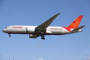 Birmingham, United Kingdom: An Air India Boeing 787‑8 Dreamliner operating flight AI117 from Amritsar, India, to Birmingham, UK, declared a general emergency due to low fuel on the evening of 8 January 2026 after prolonged holding caused by severe winter weather and the temporary closure of Birmingham Airport. The aircraft was safely diverted to London Heathrow Airport where it landed without incident, airline and flight tracking data show. Flight AI117, registration VT‑NAC, was approaching Birmingham in worsening weather as Storm Goretti brought heavy snowfall and dangerously low visibility, leading airport authorities to suspend runway operations. Visibility dipped well below the minima required for a safe landing, forcing the crew to abort the initial approach and enter a holding pattern. With extended time spent circling near the destination, fuel reserves fell toward critical levels. In response, the crew transmitted Squawk 7700 the transponder emergency code indicating a serious onboard issue requiring urgent air traffic control priority signalling a general emergency due to low fuel. This prompted expedited handling and coordination with UK air traffic control for diversion. Air Traffic Control cleared the Boeing 787 to divert to London Heathrow Airport (LHR), chosen for its longer runways and advanced Category III Instrument Landing System (ILS) capable of accommodating landing in degraded weather conditions with enhanced safety margins. The aircraft touched down safely on Heathrow’s runway 09L and subsequently taxied to gate B49 with no reported injuries to passengers or crew. Air India flight operations encountered significant disruption as snow continued to impact Birmingham Airport operations throughout the evening. The airport’s decision to close the runways was part of ongoing safety precautions amid rapid snow accumulation and deteriorating meteorological conditions. A declaration of Squawk 7700, a universal aviation emergency code does not automatically reflect a catastrophic failure; rather, it alerts all air traffic units that the flight requires priority handling due to a critical situation, in this case driven by fuel management considerations following a prolonged holding pattern.