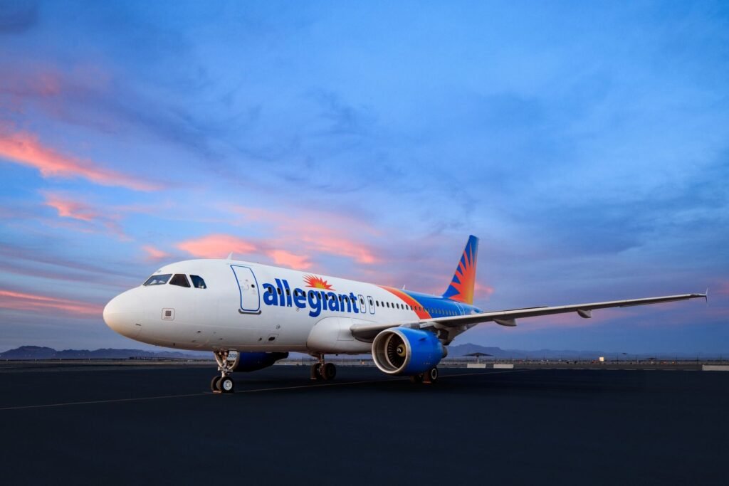 Las Vegas, United States: U.S. low-cost carrier Allegiant Travel Company has reached a definitive agreement to acquire rival Sun Country Airlines in a cash-and-stock transaction valued at approximately USD 1.5 billion, marking a significant consolidation in the nation’s leisure airline segment. Under the terms of the deal announced Sunday, Sun Country shareholders will receive 0.1557 shares of Allegiant common stock and USD 4.10 in cash for each share held, valuing Sun Country equity at about USD 18.89 per share a premium of nearly 19.8% over the airline’s closing price prior to the announcement. The enterprise value includes around USD 400 million of Sun Country’s net debt. The combined airline will operate under the Allegiant name and be headquartered in Las Vegas, with a significant operational presence maintained in Minneapolis–Saint Paul, Sun Country’s home base. The boards of both carriers have unanimously approved the transaction, which is expected to close in the second half of 2026, subject to regulatory and shareholder approvals. Once completed, the merged carrier will serve nearly 175 cities with more than 650 routes and operate an expanded fleet of about 195 aircraft, including additional orders and options across Boeing and Airbus models. The combination broadens Allegiant’s traditional focus on small and mid-sized U.S. markets with Sun Country’s larger city footprints and international leisure destinations in Mexico, the Caribbean, Canada and Central America. Allegiant Chief Executive Officer Gregory C. Anderson said the merger would strengthen both airlines’ shared mission “in providing affordable, reliable, and convenient service from underserved communities to premier leisure destinations,” citing complementary networks and expanded international opportunities. Sun Country President and CEO Jude Bricker described the deal as delivering “significant value” to shareholders and customers. Allegiant anticipates approximately USD 140 million in annual synergies within three years of closing, driven by scale efficiencies, fleet optimization and integrated scheduling. The transaction is also expected to be accretive to earnings per share in the first year after closing. Following completion, Allegiant shareholders will own about 67% of the combined company, with Sun Country shareholders holding roughly 33% on a fully diluted basis. Anderson will remain chief executive officer of the combined airline, with Robert Neal named president and chief financial officer. Bricker will join the combined board of directors. Despite the merger, both carriers will continue operating independently under their current brands until they receive a single operating certificate from the Federal Aviation Administration (FAA), a process that typically unfolds over several months. Allegiant and Sun Country have stated that the transaction will have no immediate effect on ticketing, flight schedules or customer experience. The agreement comes amid broader consolidation trends in the U.S. airline industry, particularly among low-cost and leisure carriers seeking to boost competitiveness against larger legacy airlines.