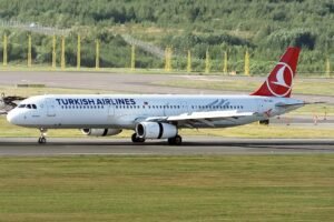 Barcelona, Spain: A Turkish Airlines Airbus A321, operating Flight TK1853 from Istanbul to Barcelona, carried out an emergency landing at Josep Tarradellas Barcelona‑El Prat Airport on Thursday morning after authorities received what was initially perceived as a bomb threat on board. The incident unfolded in the final phase of the flight, which departed Istanbul at approximately 9:22 a.m. local time and was scheduled to arrive in Barcelona around 11 a.m. As the aircraft was approaching its destination with 148 passengers and 7 crew members onboard, flight crew members were alerted to a suspicious in‑flight wireless network name that appeared to include threatening language interpreted as a bomb warning. In response to the alert, the airline’s regional communications executive, Yahya Üstün, confirmed that the crew declared an emergency and implemented standard safety protocols. Spanish authorities also activated the Aerocat emergency plan, mobilising airport security forces, fire services and the Guardia Civil to manage the situation and ensure safety. The aircraft was directed to a designated remote area of the airport upon landing at 10:57 a.m., where passengers disembarked safely and were escorted to secure facilities away from terminal operations. According to local officials, Barcelona‑El Prat continued to operate normally throughout the incident. Security personnel conducted thorough inspections of the aircraft, luggage and passengers. No explosives or hazardous materials were found, and authorities later confirmed the threat was a false alarm. Spanish and Catalan police forces led the on‑ground response, supported by civil protection units and regional emergency services. Passengers remained in secure areas while officials completed safety checks and de-escalated the risk. According to Turkish Airlines, the incident appears to have been triggered by the Wi‑Fi hotspot name created by a passenger, which included text interpreted as a bomb threat. The airline said it has initiated procedures to identify the individual responsible and will cooperate with the Spanish investigation. In a statement posted on social media platform X, Turkish Airlines reaffirmed that no irregularities were detected after security screenings, and that the aircraft’s return flight was scheduled.