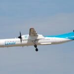 Nice, France: A Luxair regional aircraft was forced to perform an emergency landing at Nice Côte d’Azur Airport on Thursday, January 22, after the crew received a warning of a potential landing gear malfunction, the airline and aviation authorities confirmed. Flight LG8255, operated by a De Havilland Dash 8-400 turboprop registered LX-LQA, departed Luxembourg Findel Airport at approximately 13:17 local time en route to Nice with 74 passengers and crew onboard. According to initial reports, the flight crew received an “unsafe indication” for the right main landing gear during the approach to Nice. Following standard safety protocols, the aircraft aborted its first landing attempt and entered a holding pattern over the Mediterranean Sea to troubleshoot the issue. As a precautionary measure, the crew shut down the right-hand engine and prepared the cabin for an emergency landing, instructing passengers to assume the brace position. After approximately 75 minutes in the air, the aircraft returned to Nice and completed a safe landing on runway 04L, coming to a stop on the runway surface. The aircraft was unable to taxi under its own power and remained on the runway while emergency services attended. All 74 passengers and crew disembarked safely and were transported by bus to the terminal. Local airport authorities confirmed that no injuries were reported. Fire and rescue units had been pre-positioned on the runway as part of routine emergency response procedures. In response to the incident, air traffic at Nice was temporarily suspended, resulting in brief disruptions to scheduled arrivals and departures. Luxair CEO Gilles Feith described the situation as “an enormously stressful event” but praised the professionalism of the flight crew and passengers in managing the emergency. He attributed the issue to a faulty landing gear sensor, noting that after landing the indication returned to normal. “The sensor showed an unsafe indication, although the landing gear was later confirmed as locked,” Feith said in an interview. The airline has dispatched maintenance personnel and auditors to Nice to conduct a full technical investigation into the cause of the warning and ensure compliance with safety regulations.