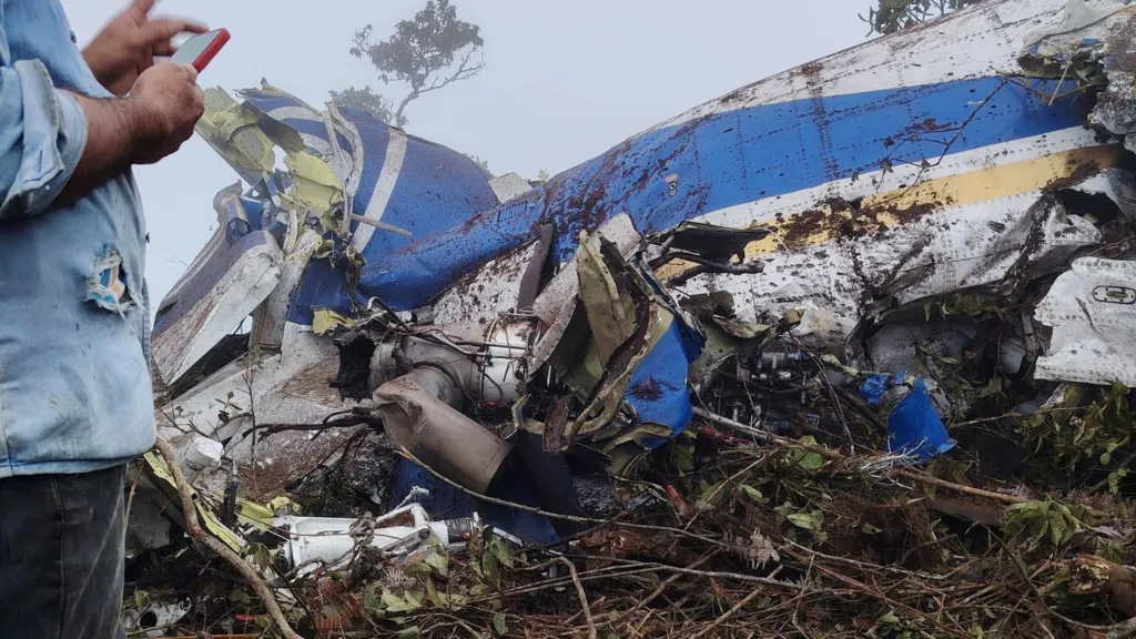 Bogota, Colombia: A scheduled domestic flight operated by state-owned airline SATENA crashed in the mountainous Norte de Santander region of northeastern Colombia on 28 January 2026, killing all 15 people on board, authorities confirmed. The twin-engine Beechcraft 1900D turboprop, registered HK-4709, was flying as SATENA Flight 8849 from Camilo Daza International Airport in Cúcuta toward Aguas Claras Airport in Ocaña when it lost radio and radar contact with air traffic control at about 11:54 a.m. local time, roughly 12 minutes into the short domestic service. Search and rescue teams later located the wreckage on a cloud-covered mountainside near Curasica in the municipality of Playa de Belén, confirming there were no survivors among the 13 passengers and two crew members. Among those killed were Diógenes Quintero Amaya, a 36-year-old member of Colombia’s House of Representatives representing the Catatumbo region, and Carlos Salcedo, a candidate in the upcoming congressional elections, according to passenger lists released by SATENA. Colombian authorities and local media also reported that members of Quintero’s team were on board. SATENA said flight crews lost contact with the aircraft shortly before its scheduled landing in Ocaña. The plane’s emergency locator transmitter did not activate, which delayed initial detection of the crash site. Once located, national authorities, including the Civil Aeronautics Authority (Aerocivil), the Colombian Aerospace Force, and military personnel, coordinated search and recovery operations in difficult terrain, hampered by dense fog and rugged mountains. No definitive cause for the crash has yet been released. Colombian aviation regulators have opened a technical investigation to determine the sequence of events leading to the accident and any contributing factors. Officials have not ruled out weather or terrain as influences, given the flight path over challenging mountainous territory near the Venezuela border. The Beechcraft 1900D involved was operated under a wet-lease arrangement by SEARCA on behalf of SATENA. The aircraft type is widely used on short regional routes for its capability to operate in and out of airports with limited infrastructure. The Cúcuta–Ocaña sector is a routine domestic service typically lasting under an hour. Radar data showed the aircraft climbed to approximately 12,900 feet before beginning its descent toward Ocaña, with its last known altitude recorded near 7,900 feet shortly before contact was lost. Colombian officials, including President Gustavo Petro, expressed condolences to the families of the victims, describing the crash as a national tragedy.
