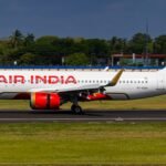 DGCA Fines Air India ₹1 Crore For Flying A320 Eight Times Without Valid ARC Permit SEO DES: The DGCA in its order said the lapse eroded public confidence. Air India said the issue was voluntarily reported & corrective actions have been taken SOCIAL: India’s aviation regulator, the Directorate General of Civil Aviation, has fined Air India $110,350 (around ₹1 crore) after an Airbus A320 operated eight flights in November 2025 without a valid Airworthiness Review Certificate (ARC). The DGCA said the lapse eroded public confidence and held the airline’s accountable manager responsible. Air India said the issue was voluntarily reported, corrective actions have been taken, and the aircraft was grounded once the error was detected. The incident has added to regulatory scrutiny of the airline’s safety systems. Delhi, India: India’s civil aviation regulator has penalised Air India with a $110,350 (about ₹1 crore) fine after an Airbus A320 aircraft operated eight commercial flights without a valid Airworthiness Review Certificate (ARC), raising fresh concerns over airline safety compliance. The Directorate General of Civil Aviation (DGCA) issued a confidential order on February 5 finding that the aircraft flew eight flights on November 24–25, 2025 including routes between New Delhi, Bengaluru, Mumbai and Hyderabad without the mandatory annual airworthiness permit that certifies an aircraft’s fitness to fly. In its order addressed to Air India Chief Executive Officer Campbell Wilson, the DGCA said the lapse had “further eroded public confidence and adversely impacted the safety compliance of the organisation.” The regulator held the airline’s “accountable manager” responsible for the breach and directed that the fine be deposited within 30 days of the order. The ARC is a critical regulatory clearance issued annually only after an aircraft undergoes detailed maintenance assessment, records verification and physical inspection to confirm conformity with prescribed safety standards. Operating without a valid certificate is considered a serious violation of civil aviation regulations. Air India acknowledged receipt of the DGCA order and stated that the incident was voluntarily reported to the regulator in late 2025. In its statement, the airline said that “all identified gaps have since been satisfactorily addressed and shared with the authority.” An internal investigation by the carrier attributed the occurrence to “systemic failures” within its compliance and oversight mechanisms. Reports indicate that pilots involved in the flights did not fully adhere to standard operating procedures before take-off, pointing to weaknesses in procedural enforcement. The implicated Airbus A320, registered VT-TQN, was returned to service after maintenance work during which its ARC inadvertently expired. The lapse remained unrecognised until flagged by engineering personnel, after which the aircraft was grounded and the matter reported to the DGCA. The fine comes amid heightened scrutiny of Air India’s safety culture, following a fatal Boeing 787 Dreamliner crash in June 2025 that claimed 260 lives. That accident triggered intensified surveillance by regulators and industry stakeholders.
