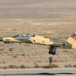 Iranian Military Aircraft Crashes In Hamadan Night Mission, One Of Two Killed Onboard SEO DES: The 31st TFS jet sustained damage during the mission but returned to Hamadan base; its landing gear failed causing it to veer off the runway SOCIAL: An Iranian military aircraft crashed during a night training mission in Hamadan province, killing one of the two pilots on board while the other survived. The Islamic Republic of Iran Air Force said the cause remains under investigation. According to Al Arabiya English, aviation expert Babak Taghvaee stated the jet from the 31st Tactical Fighter Squadron was damaged during the mission but returned to the Third Tactical Air Base in Hamadan, where landing gear failure caused it to veer off the runway. The Islamic Revolutionary Guard Corps Aerospace Force has not commented on speculation about possible fire, and the investigation is ongoing. Image: Tasnim News Agency (Wikimedia) (Representative Image) Video: TOI Hamadan, Iran: An Iranian military aircraft crashed in Hamadan province during a night training mission, killing one of the two pilots on board. The Iranian army said Thursday evening that the Islamic Republic of Iran Air Force aircraft went down in western Iran while conducting a routine nighttime exercise. One pilot was killed in the incident, while the second pilot survived. Authorities did not immediately disclose the condition of the surviving pilot. The Tehran Times named the pilot killed in the incident as Captain Mehdi Firouzmand. The air force’s public relations office confirmed that the cause of the crash remains under investigation. Officials did not provide details about its mission profile, or the sequence of events leading to the accident. According to a report by Al Arabiya English, aviation expert Babak Taghvaee said the aircraft belonged to the 31st Tactical Fighter Squadron and sustained damage during the mission. He stated that despite the damage, the pilots were able to return the aircraft to the Third Tactical Air Base in Hamadan. Taghvaee added that the landing gear failed to fully deploy during the emergency landing, causing the aircraft to veer off the runway after touchdown. The statement did not clarify whether the fatality occurred during the landing sequence or after the aircraft left the runway. No official comment was issued by the Islamic Revolutionary Guard Corps Aerospace Force regarding speculation that the aircraft may have been struck by fire. Authorities have not announced a timeline for the completion of the investigation. Further technical findings are expected once the review of flight data, maintenance records, and operational procedures is completed.