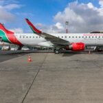 Union Strike Disrupts Kenya’s Main Airport For Two Days Before Return-To-Work Deal SEO DES: Union leaders said the strike stemmed from delays in a CBA, pay, working conditions, contract terms, staff representation and unmet past agreements SOCIAL: A two-day strike by aviation workers at Jomo Kenyatta International Airport disrupted domestic and international flights after union members walked out over unresolved labour grievances, including delays in a collective bargaining agreement, pay and working conditions. The action affected airlines such as Kenya Airways, IndiGo and Etihad Airways, causing cancellations and long delays. Following government-led talks, the Kenya Aviation Workers Union called off the strike on Feb. 17 after reaching a return-to-work agreement, with operations expected to normalise within 24 hours. Nairobi, Kenya: A strike by aviation workers at Jomo Kenyatta International Airport (JKIA), Kenya’s largest and busiest aviation hub that began on Monday morning, Feb. 16, 2026, was resolved on Tuesday, Feb. 17, 2026, after an agreement was reached between union leaders and the government, ending two days of travel chaos and flight disruptions. The industrial action started early on Feb. 16, 2026, when members of the Kenya Aviation Workers Union (KAWU) including air traffic control and other airport staff walked off the job, despite an attempt by the Kenya Civil Aviation Authority (KCAA) to block the strike through the courts. Union leaders said the strike was triggered by long-standing labour grievances, particularly delays in finalising a collective bargaining agreement (CBA), issues over pay, working conditions, contract terms, and staff representation, and the failure of authorities to honour parts of previous agreements with workers. The union had issued a seven-day strike notice before the walkout after the government and aviation authority failed to negotiate on the outstanding concerns. The strike paralysed flight operations at JKIA one of Africa’s most important aviation gateways and caused major delays and cancellations that affected both domestic and international travel. Airlines such as Kenya Airways reported air traffic control delays affecting both departures and arrivals, resulting in disrupted schedules. IndiGo cancelled its Mumbai–Nairobi–Mumbai service on Feb. 17, stranding hundreds of passengers, including Indian nationals trying to return home. Etihad Airways confirmed cancellations and delays on flights between Abu Dhabi and Nairobi due to the industrial action. Airport authorities implemented contingency plans and advised passengers to check flight statuses before travelling to the airport. Reports described backlogs in terminals, with some travellers stranded overnight and experiencing delays of up to six hours or more. After intensive talks involving the Ministry of Roads and Transport, the Ministry of Labour, the Kenya Airports Authority (KAA), the KCAA, and KAWU, an agreement was reached on Tuesday, Feb. 17, 2026, leading the union to call off the strike and commit to a return-to-work formula. Transport Cabinet Secretary Davies Chirchir led mediation efforts, stressing the importance of maintaining stability in the aviation sector for Kenya’s economy. Under the deal, all parties agreed on an immediate resumption of duties and committed to addressing outstanding issues, including reviewing staff representation, job grading, and continued negotiations on labour concerns under the guidance of the Ministry of Labour. Following the agreement, airport authorities confirmed that operations at JKIA and other affected airports were resuming gradually, with airlines working to restore normal schedules. Kenya Airways said it expected flight operations to return to normal within about 24 hours of the strike’s end.