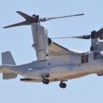 Hawaii, United States: A U.S. Marine Corps MV‑22B Osprey tiltrotor aircraft executed a precautionary emergency landing on February 3, 2026, after experiencing an in‑flight mechanical malfunction, emphasizing persistent reliability issues that have dogged the aircraft for years. The aircraft, assigned to Marine Medium Tiltrotor Squadron 268 of the 1st Marine Aircraft Wing, touched down in the Tactical Flight Training Area on Oahu, Hawaii, after pilots detected a crack in a proprotor gearbox during flight, according to testimony from military officials and lawmakers. No injuries were reported among the crew, and the Osprey remained intact, but the aircraft will undergo maintenance and repairs before returning to service, the Marine Corps statement said. The incident occurred days before Naval Air Systems Command leaders were scheduled to brief Congress on progress in addressing longstanding mechanical challenges confronting the V‑22 fleet. At a February 10 congressional hearing, Navy and Marine Corps representatives acknowledged ongoing risks associated with the aircraft’s complex gearbox and drivetrain system, which transfers power from its engines to the tiltrotor mechanism. Lawmakers were told that while interim gearbox solutions are in service, permanent design improvements remain years away from full implementation. Vice Admiral John Dougherty, commander of Naval Air Systems Command (NAVAIR), testified that redesigned Input Quill Assemblies intended to eliminate abrupt clutch engagements and similar failures, are slated for fielding in late 2027, with broader fleet upgrades continuing into the early 2030s. The Marine Corps’ latest aviation plan described the MV‑22 as a “cornerstone” of air‑ground mobility forces due to its speed, range, and versatility, but acknowledged that limitations remain due to safety controls imposed after fatal mishaps. Recent reviews by the Government Accountability Office (GAO) and military safety offices revealed that V‑22 Ospreys continue to experience higher rates of serious accidents compared with other fixed‑ and rotary‑wing aircraft. The GAO testimony shared data showing that serious mishap rates involving Ospreys in fiscal years 2022 and 2023 were substantially above historical averages, contributing to congressional concern about the aircraft’s safety profile. A gearbox failure was the root cause of a 2023 Air Force Osprey crash that killed eight airmen and a 2022 crash that killed five Marines. Additionally, independent assessments noted faulty materials in gearbox components and lapses in inter‑service communication regarding safety and risk data among the Marine Corps, Navy, and Air Force factors that have compounded operational challenges. Fielding of improved gearboxes began in January 2026, with officials reporting a steady delivery rate of upgraded units to Osprey squadrons. However, full retrofit of the fleet is not expected to be completed until 2027, and broader transmission and avionics modernization programs are planned well into the next decade. Defense analysts have noted that the V‑22’s tiltrotor design, while offering unmatched operational flexibility, also introduces complex mechanical stresses that have proven difficult to fully mitigate, even after decades of service.