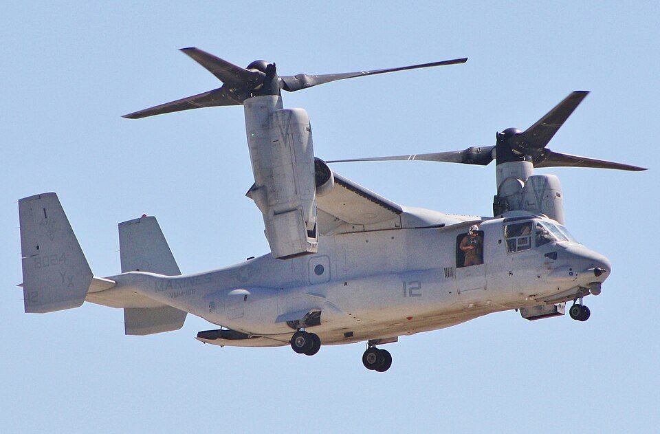 Hawaii, United States: A U.S. Marine Corps MV‑22B Osprey tiltrotor aircraft executed a precautionary emergency landing on February 3, 2026, after experiencing an in‑flight mechanical malfunction, emphasizing persistent reliability issues that have dogged the aircraft for years. The aircraft, assigned to Marine Medium Tiltrotor Squadron 268 of the 1st Marine Aircraft Wing, touched down in the Tactical Flight Training Area on Oahu, Hawaii, after pilots detected a crack in a proprotor gearbox during flight, according to testimony from military officials and lawmakers. No injuries were reported among the crew, and the Osprey remained intact, but the aircraft will undergo maintenance and repairs before returning to service, the Marine Corps statement said. The incident occurred days before Naval Air Systems Command leaders were scheduled to brief Congress on progress in addressing longstanding mechanical challenges confronting the V‑22 fleet. At a February 10 congressional hearing, Navy and Marine Corps representatives acknowledged ongoing risks associated with the aircraft’s complex gearbox and drivetrain system, which transfers power from its engines to the tiltrotor mechanism. Lawmakers were told that while interim gearbox solutions are in service, permanent design improvements remain years away from full implementation. Vice Admiral John Dougherty, commander of Naval Air Systems Command (NAVAIR), testified that redesigned Input Quill Assemblies intended to eliminate abrupt clutch engagements and similar failures, are slated for fielding in late 2027, with broader fleet upgrades continuing into the early 2030s. The Marine Corps’ latest aviation plan described the MV‑22 as a “cornerstone” of air‑ground mobility forces due to its speed, range, and versatility, but acknowledged that limitations remain due to safety controls imposed after fatal mishaps. Recent reviews by the Government Accountability Office (GAO) and military safety offices revealed that V‑22 Ospreys continue to experience higher rates of serious accidents compared with other fixed‑ and rotary‑wing aircraft. The GAO testimony shared data showing that serious mishap rates involving Ospreys in fiscal years 2022 and 2023 were substantially above historical averages, contributing to congressional concern about the aircraft’s safety profile. A gearbox failure was the root cause of a 2023 Air Force Osprey crash that killed eight airmen and a 2022 crash that killed five Marines. Additionally, independent assessments noted faulty materials in gearbox components and lapses in inter‑service communication regarding safety and risk data among the Marine Corps, Navy, and Air Force factors that have compounded operational challenges. Fielding of improved gearboxes began in January 2026, with officials reporting a steady delivery rate of upgraded units to Osprey squadrons. However, full retrofit of the fleet is not expected to be completed until 2027, and broader transmission and avionics modernization programs are planned well into the next decade. Defense analysts have noted that the V‑22’s tiltrotor design, while offering unmatched operational flexibility, also introduces complex mechanical stresses that have proven difficult to fully mitigate, even after decades of service.