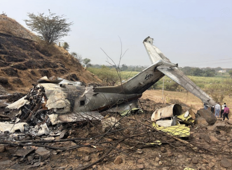 Baramati, India: The Aircraft Accident Investigation Bureau (AAIB) has released its preliminary report into the accident involving a Learjet 45XR aircraft, registration VT-SSK, which crash-landed at Baramati on 28 January 2026, resulting in five fatalities including the Hon’ble Deputy Chief Minister of Maharashtra. IMPORTANT NOTE: As per the AAIB, this report contains preliminary factual information subject to change. In accordance with ICAO Annex 13, the sole objective of this investigation is the prevention of future accidents and not the apportioning of blame or liability. No final conclusions should be drawn from this document at this stage. The aircraft, operated by M/s VSR Ventures Pvt. Ltd., was conducting a non-scheduled passenger flight from Chhatrapati Shivaji Maharaj International Airport (Mumbai) to Baramati. The accident occurred at approximately 0316 UTC (0846 IST) during the landing phase on Runway 11 at the uncontrolled Baramati airfield. Aircraft and Crew The aircraft was a Learjet 45XR (Serial No. 417), manufactured in 2010 and powered by Honeywell TFE 731-20BR-1B engines. It held a valid Certificate of Airworthiness and Airworthiness Review Certificate at the time of the accident. The aircraft had accumulated 4,915:48 total airframe hours. On board were two flight crew members, one cabin attendant and two passengers. All five occupants sustained fatal injuries. The Pilot-in-Command, aged 61, held an Airline Transport Pilot Licence (ATPL) and had 18,855 total flying hours, including 2,815 hours on type. The First Officer, aged 25, held a Commercial Pilot Licence (CPL) and had 2,490 total flying hours, including 2,243 hours on type. Both pilots were current and medically valid. Pre-flight breath analyser tests conducted prior to departure were reported as negative. Flight and Approach The flight departed Mumbai after filing a flight plan to Baramati, with Pune and Mumbai listed as alternates. The aircraft took off from Runway 27 at Mumbai and climbed to FL190 before descending toward Baramati. Baramati is an uncontrolled airfield managed by M/s Maharashtra Airport Development Company Limited (MADC). The aerodrome permits only Visual Flight Rules (VFR) operations and does not have navigational aids other than windsocks. The runway orientation is 11/29, with displaced thresholds of 1,400 ft for Runway 11 and 500 ft for Runway 29. According to the report, the airfield does not have a Meteorological (MET) facility. Weather information is relayed using instruments installed in a temporary tower operated by one of the flying training organisations based at the airfield. During the initial approach, the crew requested visibility information and were advised it was 3 kilometres. The report notes that the visibility required for VFR flight is 5 kilometres. The aircraft continued the approach but initiated a go-around. On the second approach to Runway 11, the aircraft reported the field in sight and was cleared to land. Winds were reported as calm. Shortly thereafter, the aircraft was heard transmitting “Oh S**T Oh S**T” before impacting terrain to the left of Runway 11, abeam the threshold. CCTV footage from a nearby village reportedly showed the aircraft banking to the right before striking trees and impacting ground approximately 50 metres left of the runway edge. The aircraft was engulfed in fire and was destroyed. Aerodrome Observations During on-site inspection, investigators observed faded runway markings and the presence of loose gravel on the runway surface. The last runway re-carpeting was conducted in March 2016. The report also states that the aerodrome does not have an in-house Aircraft Rescue and Fire Fighting (ARFF) unit. Firefighting and ambulance services are provided by the Baramati Municipal Corporation upon request. Additionally, the aerodrome does not have a boundary wall, and fencing was reported to be inadequate. Weather Context METAR data from nearby controlled airports showed reduced visibility conditions on the morning of the accident. Pune reported visibility as low as 2,000 metres between 0240 and 0300 UTC, while Mumbai reported 2,500 metres visibility during the period. Satellite imagery from INSAT-3DR indicated no significant clouding over Pune but suggested the presence of shallow fog patches in the vicinity of Baramati. Flight Recorders Both the Solid-State Flight Data Recorder (SSFDR) and Solid-State Cockpit Voice Recorder (SSCVR) were recovered from the tail section. Although both units sustained thermal damage, raw data from the SSFDR has been successfully downloaded at the AAIB laboratory in New Delhi and is under analysis. Due to thermal damage and manufacturer considerations, assistance has been sought from the United States to recover data from the SSCVR, in accordance with ICAO Annex 13 provisions. The National Transportation Safety Board (NTSB), USA, has appointed an Accredited Representative and technical advisers to assist in the investigation. Interim Safety Recommendations Based on interim findings, the AAIB has issued safety recommendations to the Directorate General of Civil Aviation (DGCA). These include directing operators conducting VFR flights to uncontrolled airfields to strictly adhere to standard operating procedures, and ensuring flying operations are permitted only when prevailing meteorological conditions meet regulatory criteria. The AAIB has also recommended that DGCA issue directions to stakeholders responsible for managing uncontrolled airfields to maintain required safety standards, enhance landing aids and basic MET facilities, and examine the feasibility of licensing such aerodromes for regulated operations.