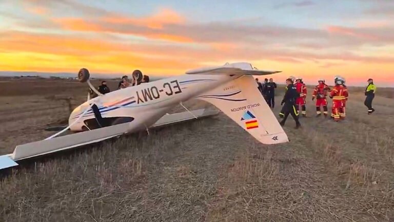 Small Training Aircraft Flips During Emergency Landing Near Madrid, Pilot Uninjured SEO DES: The aircraft operated by World Aviation Flight Academy had flown earlier without issues, authorities are probing the cause of the emergency landing SOCIAL: A Tecnam P2008JC light training aircraft overturned during an emergency landing near the M-407 road in Leganés, south of Madrid, on February 17. The 28-year-old trainee pilot escaped unhurt, and emergency responders confirmed there was no fire or fuel leakage. Crews from Emergencias 112, SUMMA 112, and local fire units secured the scene while Policía Local and Policía Nacional launched a preliminary investigation. The aircraft, operated by World Aviation Flight Academy and based at Cuatro Vientos Airport, had completed earlier flights without reported issues. Authorities are reviewing the cause of the emergency landing. No other occupants were onboard, and traffic in the area was largely unaffected. Madrid, Spain: A light training aircraft overturned during an emergency landing in a field near the M-407 road in Leganés, south of Madrid, on Tuesday evening, authorities confirmed. The pilot, a 28-year-old trainee, escaped without injury and first responders ruled out fire or fuel leakage at the scene. The incident unfolded shortly before 18:30 local time on February 17, when the single-engine plane, identified as a Tecnam P2008JC, was forced to make an unplanned descent to a clearing adjacent to the busy regional highway. The aircraft came to rest upside down after touching down, according to local emergency services. Emergency crews from Emergencias 112 Comunidad de Madrid, the SUMMA 112 medical service, and fire units responded promptly. The pilot was found conscious, oriented, and uninjured, and was subsequently evaluated by medical personnel as a precaution. Two fire crews conducted preventive measures to ensure there were no risks of ignition or hazardous spills, while officers from the Policía Local and Policía Nacional secured the perimeter and began a preliminary investigation into the circumstances that prompted the emergency landing. Video footage circulating from the site depicts the small plane resting inverted in the grass beside the road. The aircraft’s registration number and exterior logo indicate that it belongs to World Aviation Flight Academy, a flight training academy based at Cuatro Vientos Airport in Madrid. The aircraft is used by flight schools for pilot training and had completed earlier flights that day without reported issues. The exact cause of the emergency, whether mechanical malfunction or another operational factor, remains under review by the Policía Nacional’s aviation unit. No other individuals were reported to be aboard the aircraft at the time of the incident. Road traffic was not significantly disrupted, and neighbouring facilities, including a nearby industrial estate, remained unaffected.