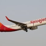 SpiceJet Delhi-Leh Flight Makes Emergency Return After Engine Snag, All 150 Onboard Safe SEO DES: At around 9,000 ft, sparks were seen from the right engine, indicating a No.2 engine issue and prompting the crew to halt the climb and return to Delhi SOCIAL: A SpiceJet Boeing 737-700 operating flight SG-121 from Delhi to Leh made an emergency return to Indira Gandhi International Airport shortly after takeoff after the crew detected a technical issue with one engine during the initial climb. Authorities declared a full emergency as a precaution, and the aircraft landed safely around 6:55 a.m. All approximately 150 passengers and crew disembarked normally, no injuries were reported, and the aircraft was grounded for inspection. Image: Nisarg Vyas (Flickr) Video: SpiceJet New Delhi, India: A SpiceJet aircraft operating on the SG-121 Delhi–Leh route made an emergency return to Indira Gandhi International Airport (IGI) early Tuesday morning after the flight crew detected a technical malfunction in one of the aircraft’s engines shortly after takeoff. The Boeing 737-700 jet, carrying approximately 150 passengers and crew, departed Delhi at about 6:21 a.m. IST but initiated an immediate air return within minutes of takeoff when indications of a problem with engine number two emerged. Airport officials confirmed that a “full emergency” was declared at IGI to ensure all runway and rescue units were positioned for a potential unscheduled landing. Fire tenders, ambulances, and medical teams were on standby as standard safety procedures were executed. Despite the onboard alert, there were no fire warnings in the cockpit, according to a statement released by SpiceJet. The flight crew reported the technical anomaly to Air Traffic Control and returned to the departure airport without further incident. The aircraft landed safely at IGI at around 6:55 a.m. IST, with all passengers disembarking normally. There were no injuries reported, and airport operations resumed shortly thereafter. A SpiceJet spokesperson reiterated that the decision to return was a precautionary measure following the technical issue. “The aircraft landed safely in Delhi, and all passengers disembarked normally,” the airline said in its official comment. Preliminary flight tracking data indicates the jet had begun its climb and had reached approximately 9,000 feet when sparks were observed from the right-hand engine, prompting the flight crew to halt the ascent and return to Delhi. The Delhi-Leh route is among India’s more challenging due to high altitude terrain and stringent operational standards. Airlines typically maintain strict maintenance protocols to mitigate technical risks on such segments.