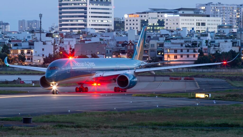 Hanoi, Vietnam: Vietnam Airlines (HVN) delivered its strongest financial performance in history in 2025, posting record annual revenue and sharply improved profitability, according to its fourth-quarter financial statements released on January 29. In the fourth quarter of 2025, the national flag carrier recorded consolidated revenue of VND 32.34 trillion (approx. US$1.3 billion), an increase of 12 percent year-on-year. Consolidated pre-tax profit reached nearly VND 540 billion during the period. Vietnam Airlines attributed the strong Q4 performance to higher seat occupancy rates and growing passenger and cargo volumes, particularly on international and regional routes. The airline also increased flight frequencies on key international services and optimized fleet utilization to meet strong demand during the year-end peak travel season. Vietnam Airlines reported consolidated revenue of more than VND 21.43 trillion for the full year 2025, marking the highest annual revenue in the company’s history and a rise of about 10 percent compared with 2024. Consolidated after-tax profit exceeded VND 7.71 trillion, with the portion attributable to the parent company reaching VND 5.51 trillion more than double that of the prior year. Beyond operational gains, Vietnam Airlines implemented multiple service upgrades aimed at boosting passenger experience and strengthening competitiveness. These included: Launch of in-flight internet services. Introduction of the carrier’s signature fragrance, “Nha”. More synchronized services at Terminal 3 of Tân Sơn Nhất International Airport. Biometric VNeID check-in capabilities. Expansion and upgrades of Lotus lounges at major airports. According to the airline, these enhancements not only elevated the travel experience but also supported business performance during the critical holiday period. Vietnam Airlines also strengthened its financial foundations in 2025 by successfully issuing 897 million new shares. This helped return both parent and consolidated equity to positive territory by the end of the year. The airline contributed VND 3.29 trillion to the State budget, a 5 percent year-on-year increase, underscoring its expanding role in supporting Vietnam’s broader economic recovery and growth. Looking ahead, Vietnam Airlines plans to build on the momentum of 2025 by enhancing operational efficiency and financial performance. For 2026, the carrier is targeting: 29.07 million passengers, a 13.2 percent increase over 2025. Approximately 13 percent growth in available seat kilometres to tap into rising demand across the Asia-Pacific aviation market. With a strengthened balance sheet and improving profitability, Vietnam Airlines said it is positioning itself for sustainable medium- and long-term growth while progressing toward its goal of becoming a five-star international airline by 2030.